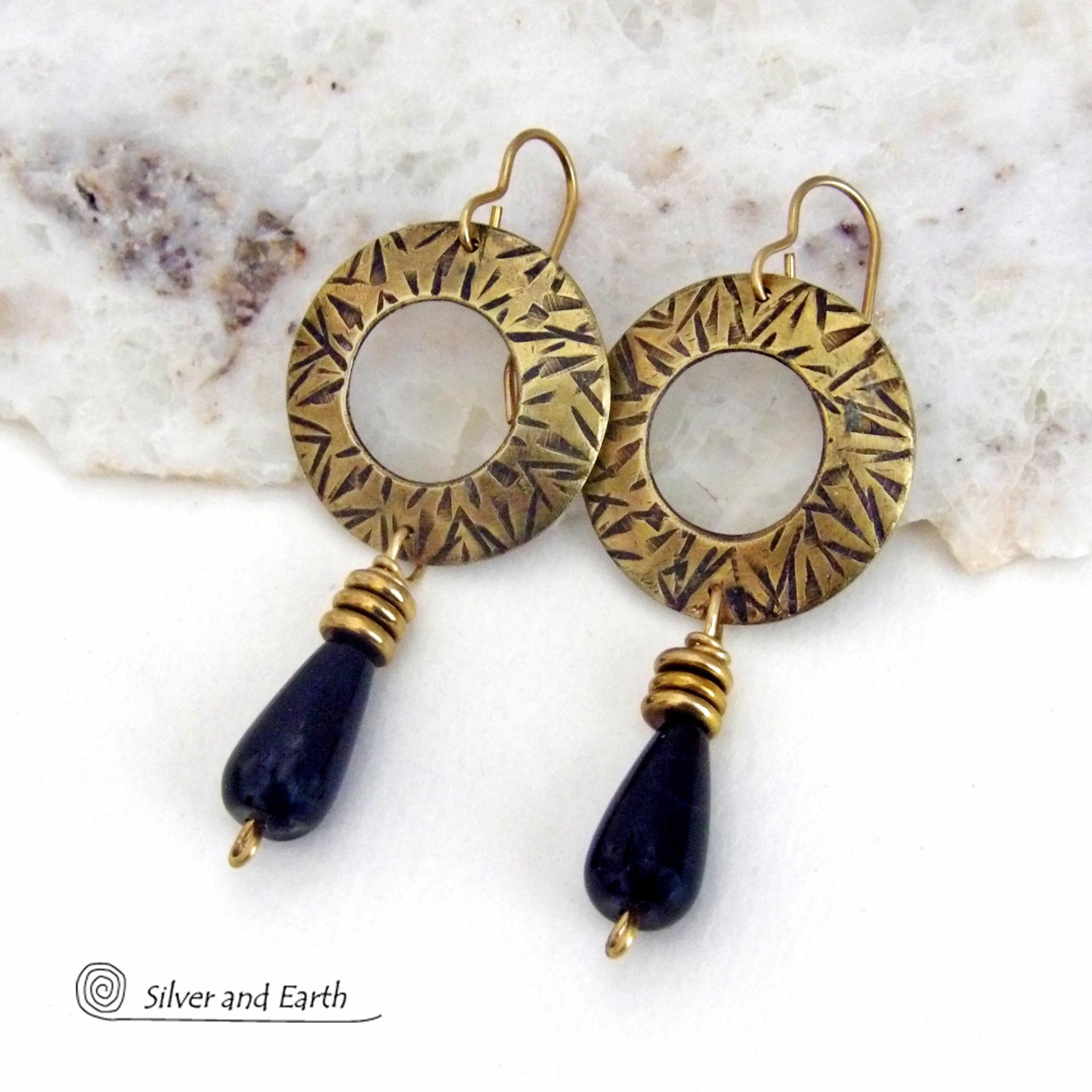 These handcrafted gold brass earrings have a hand stamped texture and are accented with teardrop shaped black onyx gemstones and brass beads. They have a modern chic vibe that coordinates beautifully with all wardrobe styles. Perfect for women that love to wear one of a kind artisan handcrafted jewelry. Handmade in the USA by Silver and Earth Jewelry. Total length of approximately 2-1/4" from top of brass ear wires and 1” at widest point. 