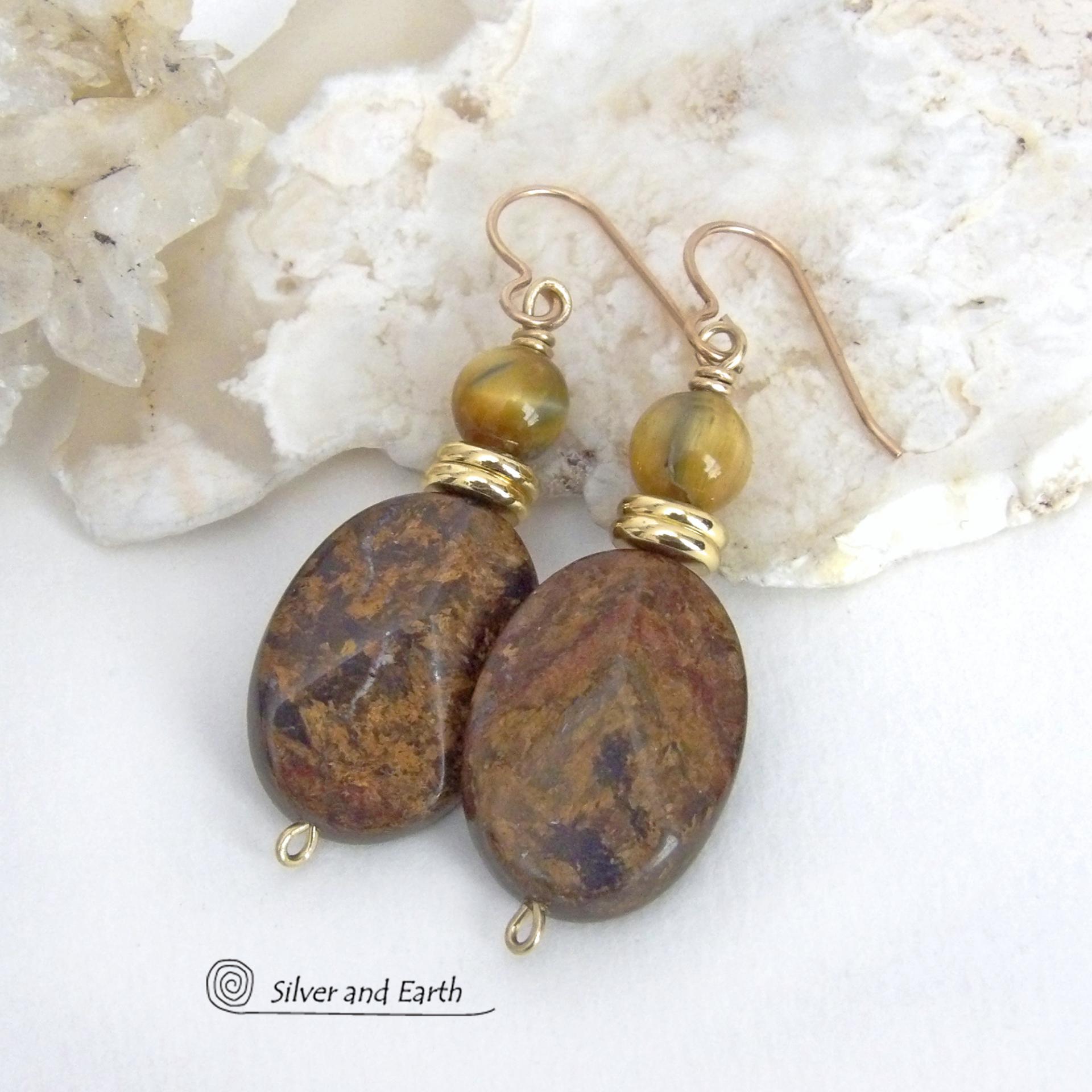 These handcrafted earrings feature natural bronzite gemstones with a faceted finish accented with golden tiger's eye gemstones and shiny brass beads. The bronzite stones have a beautiful chocolate brown hue with subtle *gold tone* metallic inclusions. Bronzite is a blend of several minerals which gives it a unique mottled appearance. They have a modern, earthy appeal and will make a great gift for a nature lover - or an interesting addition to your own jewelry wardrobe. Handmade in the USA by Silver and Ear