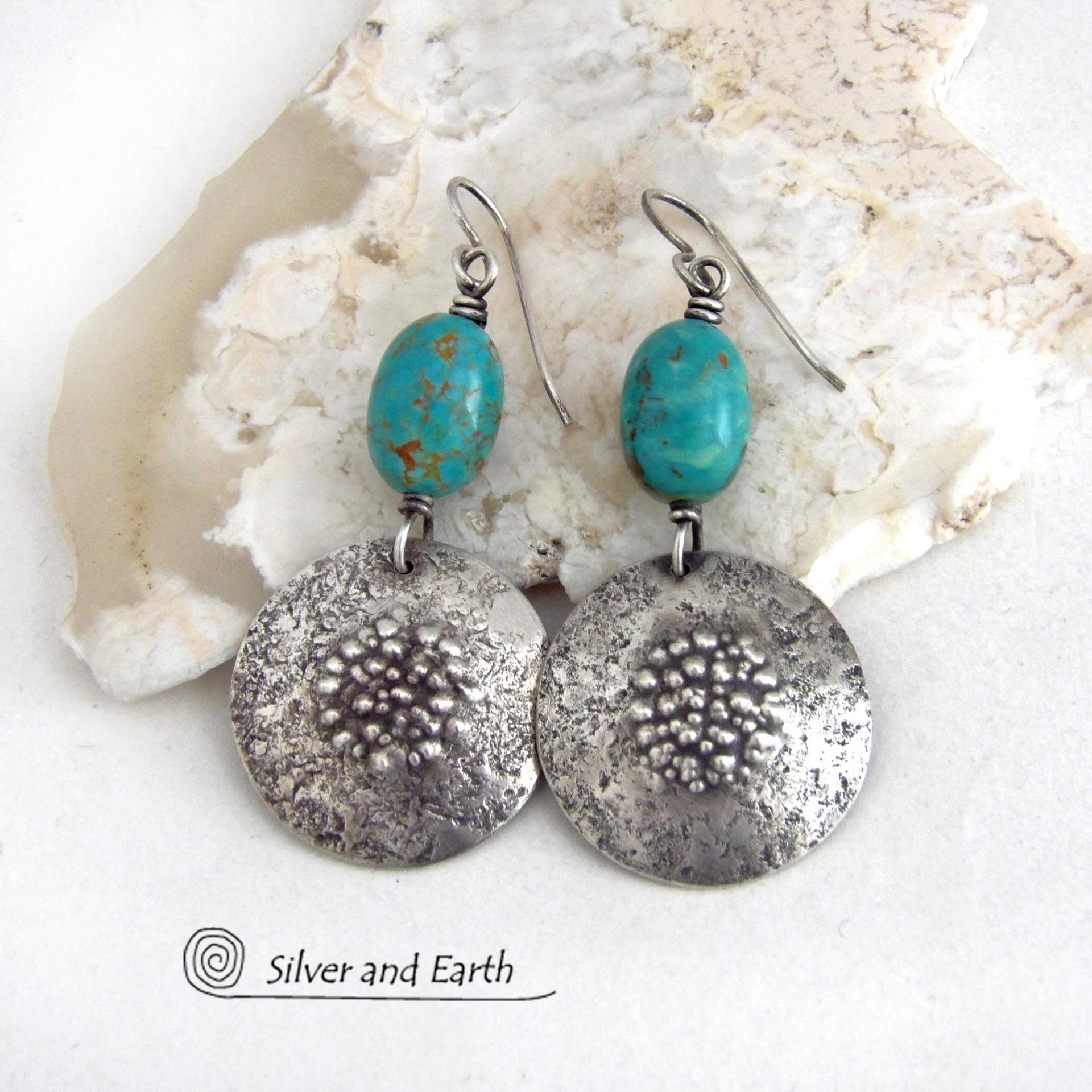 These handcrafted earrings feature natural turquoise nuggets accented with round sterling silver dangles with a rustic hammered and stamped texture. The stones are a gorgeous shade of turquoise with a subtle natural copper matrix. They have a modern, earthy organic style with a touch of southwestern flair. Handmade by Silver and Earth, a New Mexico True Certified Business.