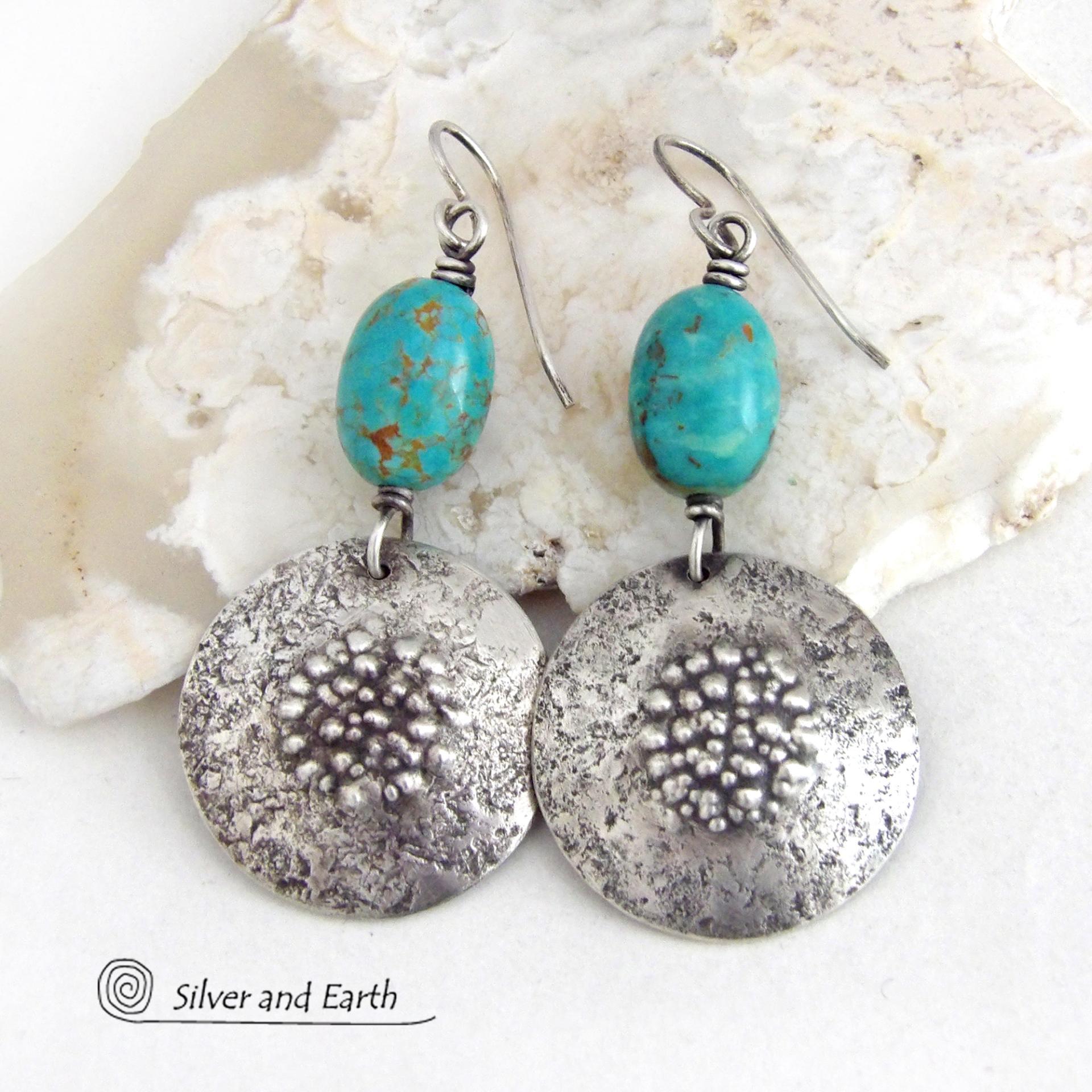 These handcrafted earrings feature natural turquoise nuggets accented with round sterling silver dangles with a rustic hammered and stamped texture. The stones are a gorgeous shade of turquoise with a subtle natural copper matrix. They have a modern, earthy organic style with a touch of southwestern flair.