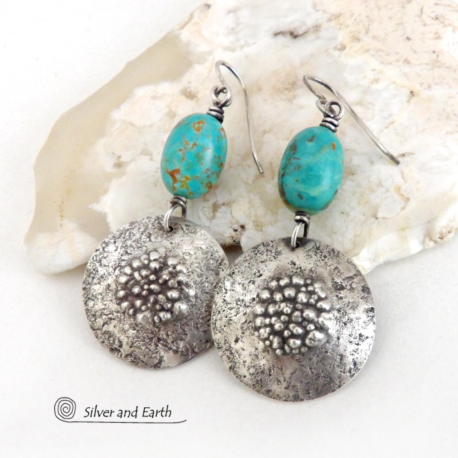 These handcrafted earrings feature natural turquoise nuggets accented with round sterling silver dangles with a rustic hammered and stamped texture. The stones are a gorgeous shade of turquoise with a subtle natural copper matrix. They have a modern, earthy organic style with a touch of southwestern flair.
