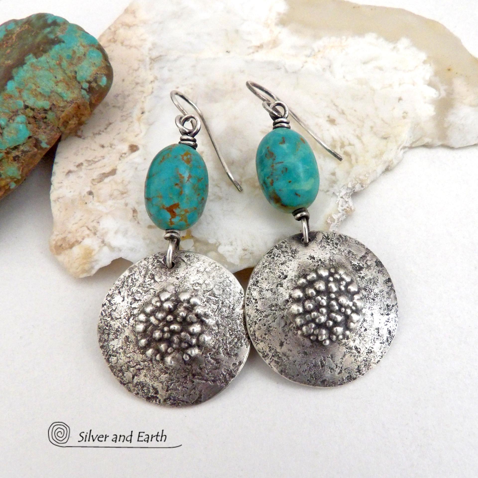 These handcrafted earrings feature natural turquoise nuggets accented with round sterling silver dangles with a rustic hammered and stamped texture. The stones are a gorgeous shade of turquoise with a subtle natural copper matrix. They have a modern, earthy organic style with a touch of southwestern flair. Handmade by Silver and Earth, a New Mexico True Certified Business.