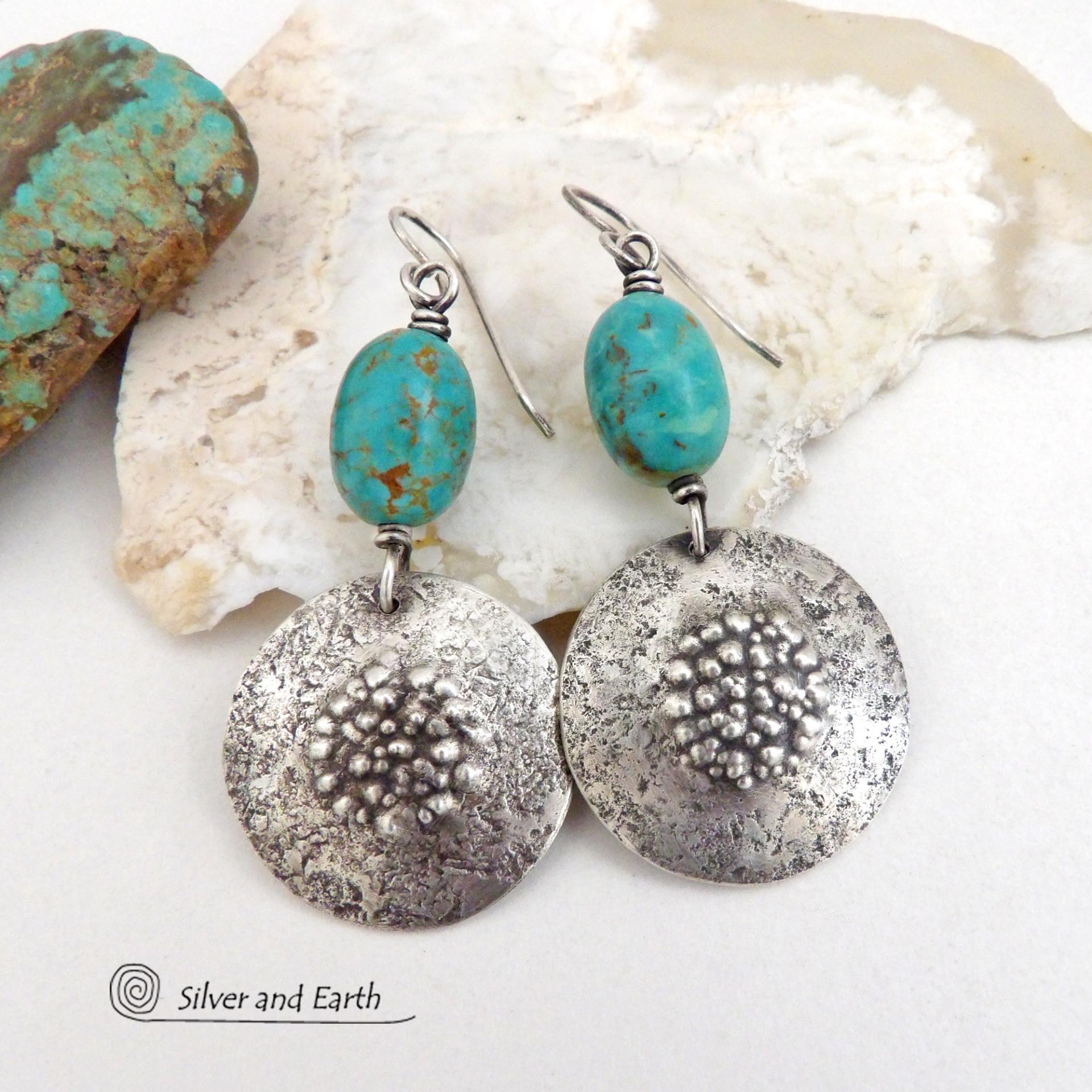 These handcrafted earrings feature natural turquoise nuggets accented with round sterling silver dangles with a rustic hammered and stamped texture. The stones are a gorgeous shade of turquoise with a subtle natural copper matrix. They have a modern, earthy organic style with a touch of southwestern flair.