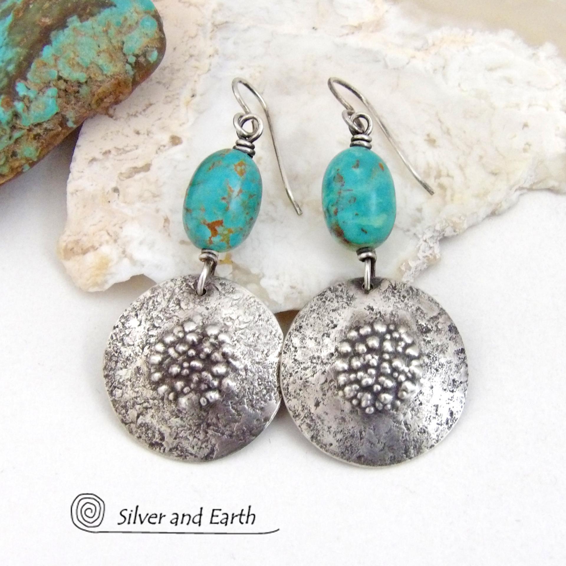 These handcrafted earrings feature natural turquoise nuggets accented with round sterling silver dangles with a rustic hammered and stamped texture. The stones are a gorgeous shade of turquoise with a subtle natural copper matrix. They have a modern, earthy organic style with a touch of southwestern flair.
