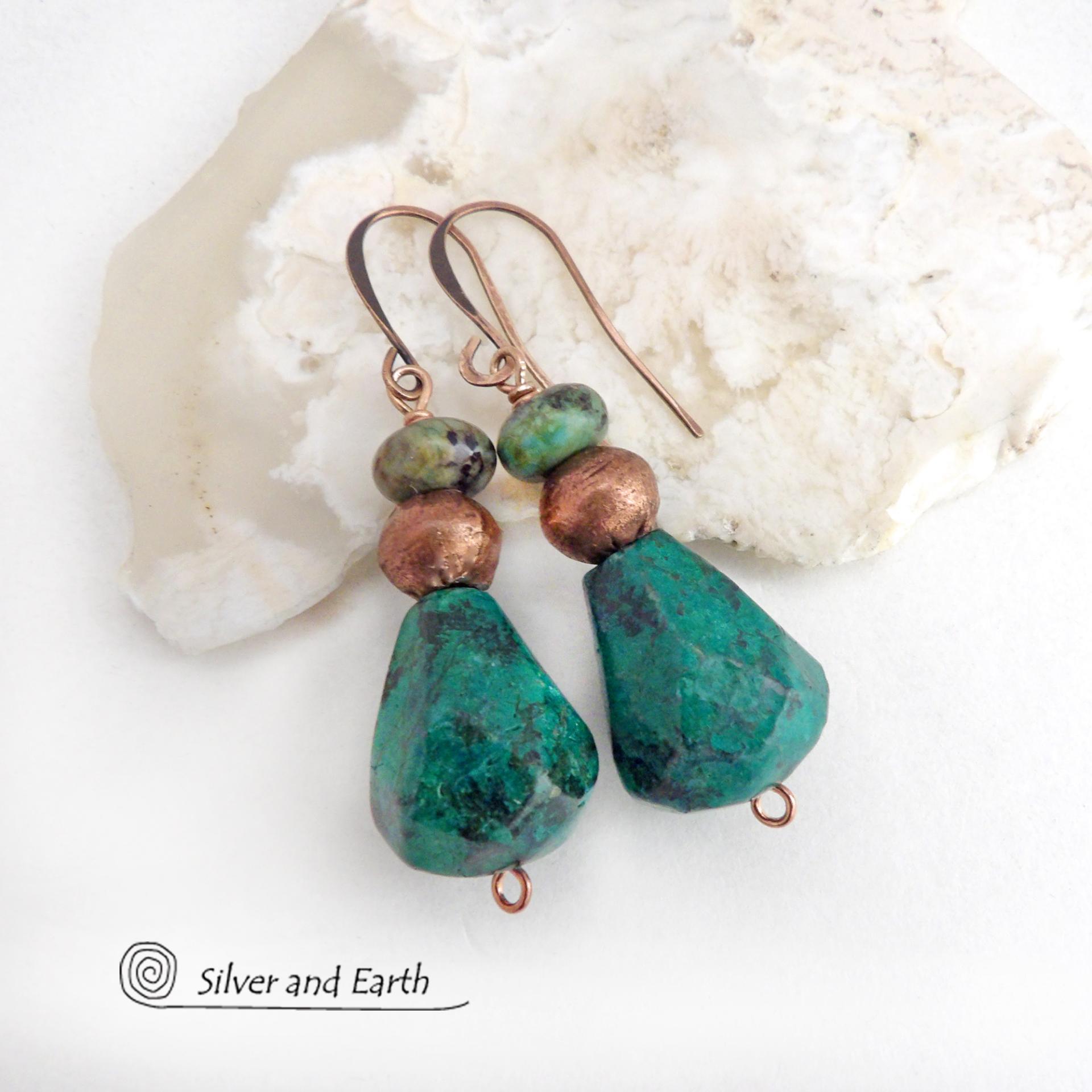 Natural chunky African turquoise gemstones are accented with copper beads and smaller African turquoise beads in these modern boho earrings. The stones on the bottom have an organic faceted cut. They'll make a great gift for anyone that loves natural stone jewelry - or a nice addition to your own jewelry wardrobe.