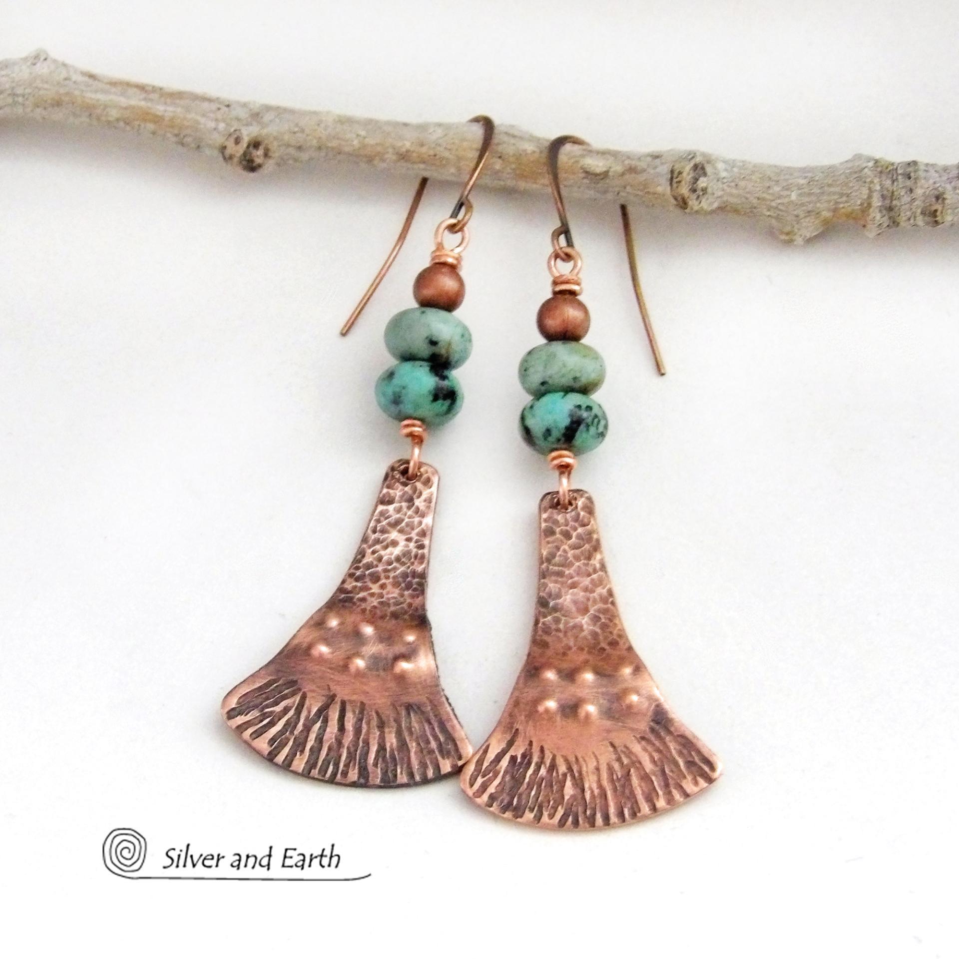 These handcrafted earrings feature uniquely textured copper dangles accented with a stack of natural African turquoise stones topped off with copper beads. They have an earthy chic, bohemian style and will make a striking statement. Makes a great gift for couples celebrating their seventh wedding anniversary, as copper is the traditional choice for this occasion.