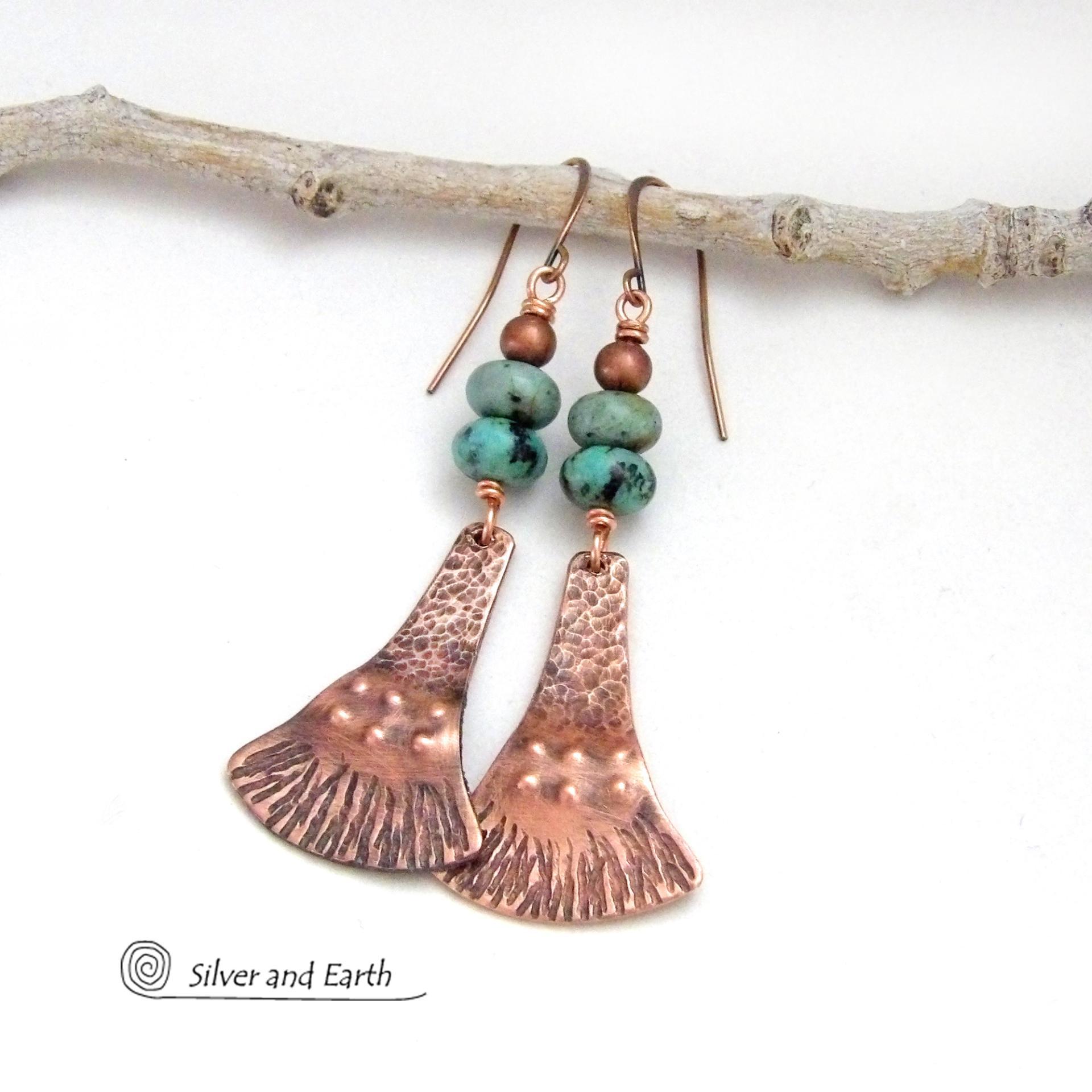 These handcrafted earrings feature uniquely textured copper dangles accented with a stack of natural African turquoise stones topped off with copper beads. They have an earthy chic, bohemian style and will make a striking statement. Makes a great gift for couples celebrating their seventh wedding anniversary, as copper is the traditional choice for this occasion.