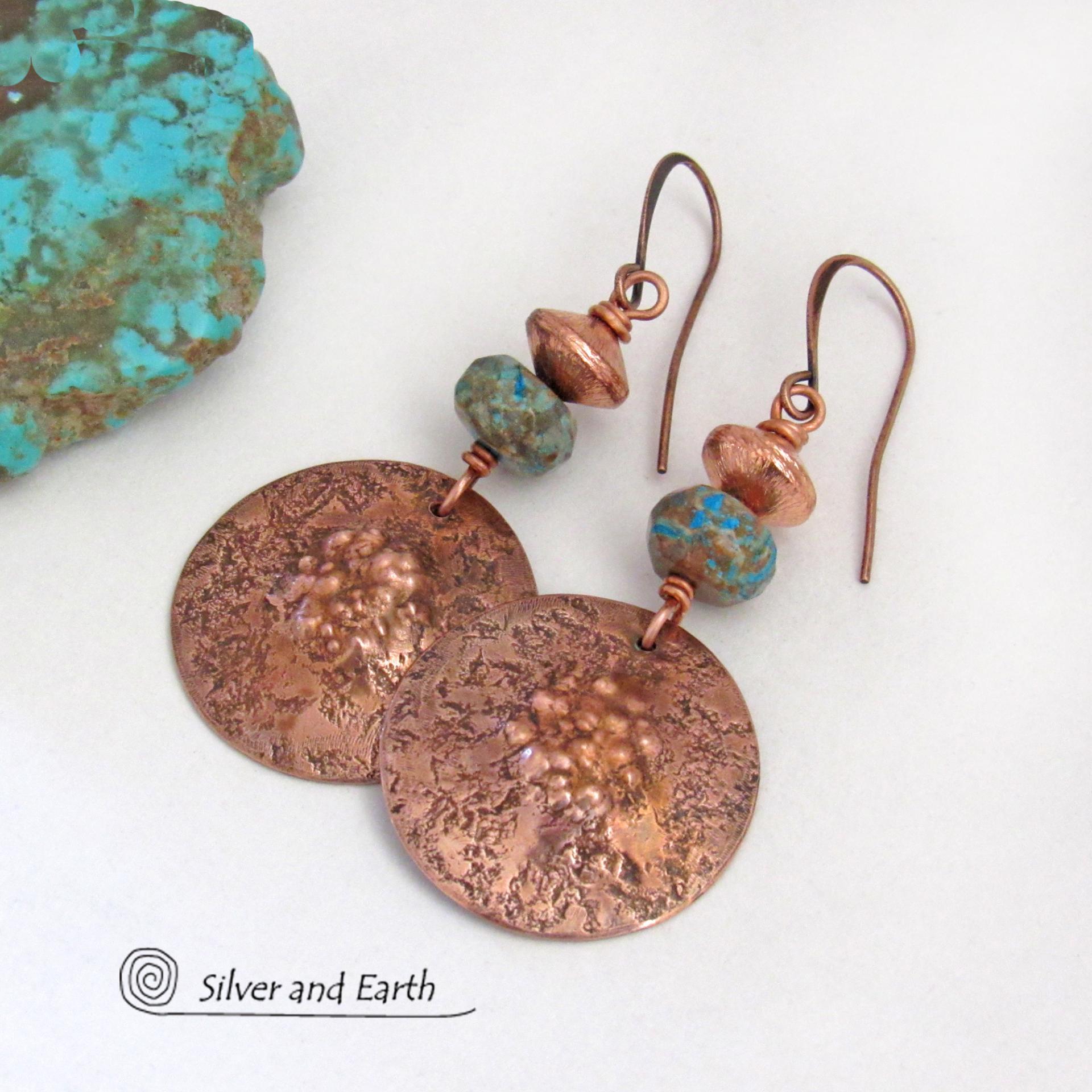 These earrings feature round copper dangles with a rustic, organic hammered texture accented with faceted calsilica jasper stones and brushed satin copper beads. The stones have a pretty blue hue combined with an earthy brown matrix. They have a modern style with a subtle bohemian flair that works well with all wardrobe types. They'll make a great gift for couples celebrating their 7th wedding anniversary --- copper is the traditional choice for this anniversary. 