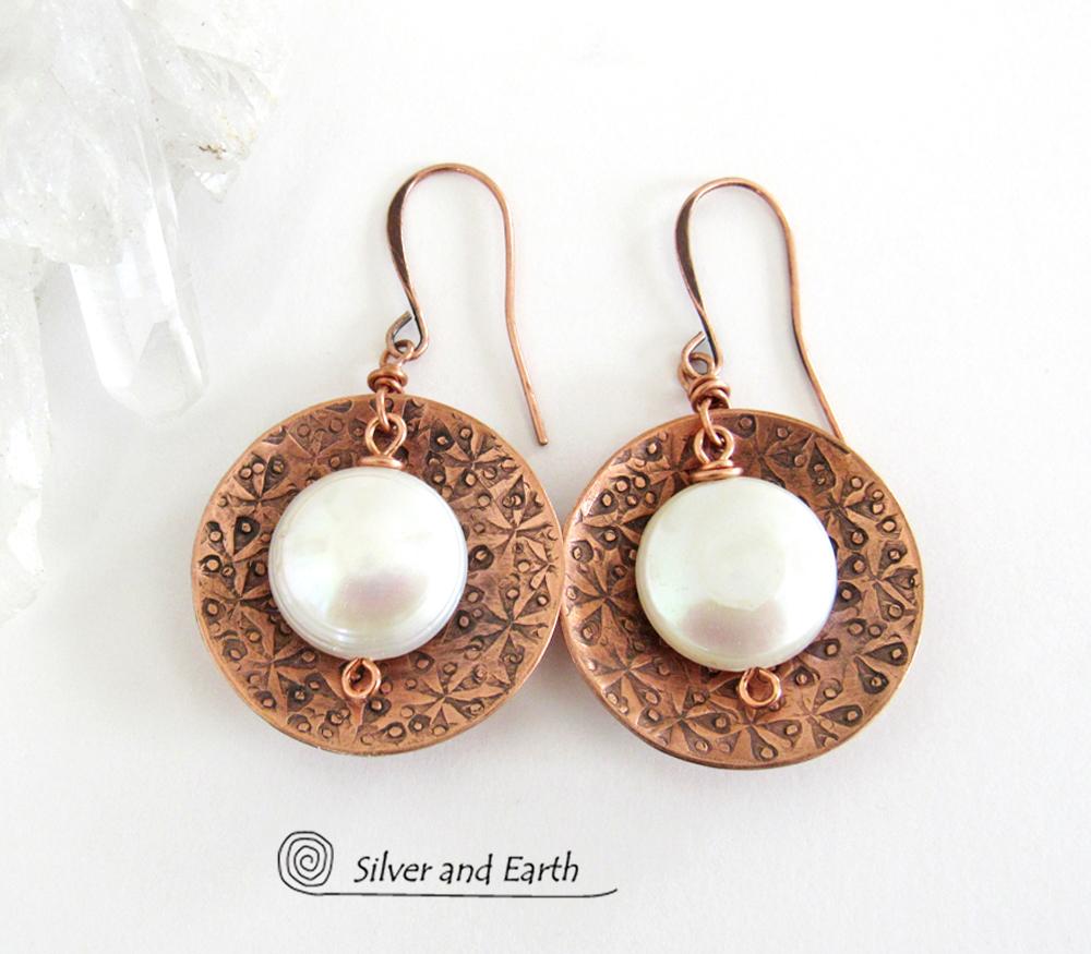 Artisan handcrafted copper earrings with a feminine, elegant style accented with white freshwater coin shaped pearls. Perfect for all occasions, they'll look great dressed up or down. Makes a great gift for couples celebrating their seventh wedding anniversary, as copper is the traditional choice for this occasion. 
