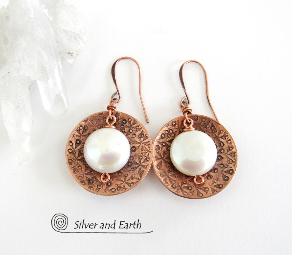 Artisan handcrafted copper earrings with a feminine, elegant style accented with white freshwater coin shaped pearls. Perfect for all occasions, they'll look great dressed up or down. Makes a great gift for couples celebrating their seventh wedding anniversary, as copper is the traditional choice for this occasion. 