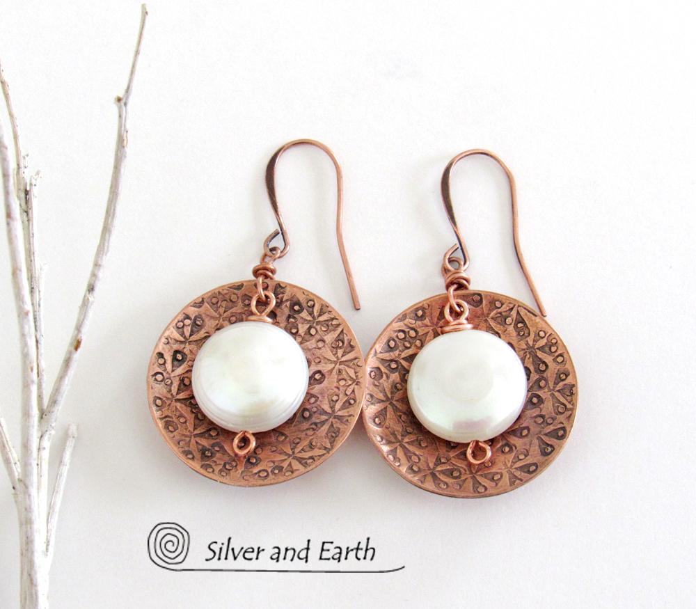 Artisan handcrafted copper earrings with a feminine, elegant style accented with white freshwater coin shaped pearls. Perfect for all occasions, they'll look great dressed up or down. Makes a great gift for couples celebrating their seventh wedding anniversary, as copper is the traditional choice for this occasion. 