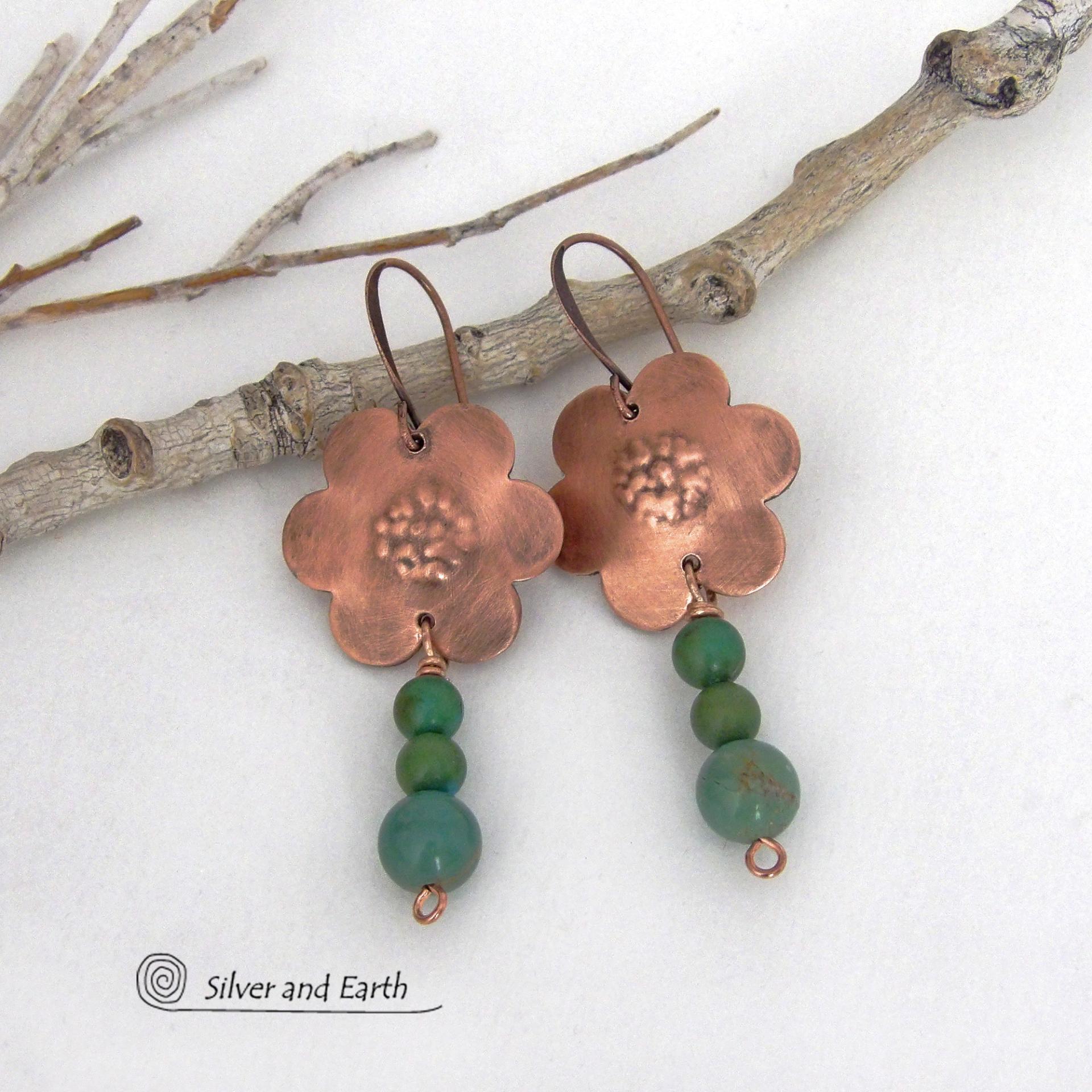 These hand forged copper flower earrings are accented with a stack of dangling turquoise stones. They have an earthy, whimsical charm and will make a great gift for nature / flower lovers and couples celebrating their seventh wedding anniversary. Copper is the traditional choice for this anniversary. Handmade in the USA by Silver and Earth Jewelry. 