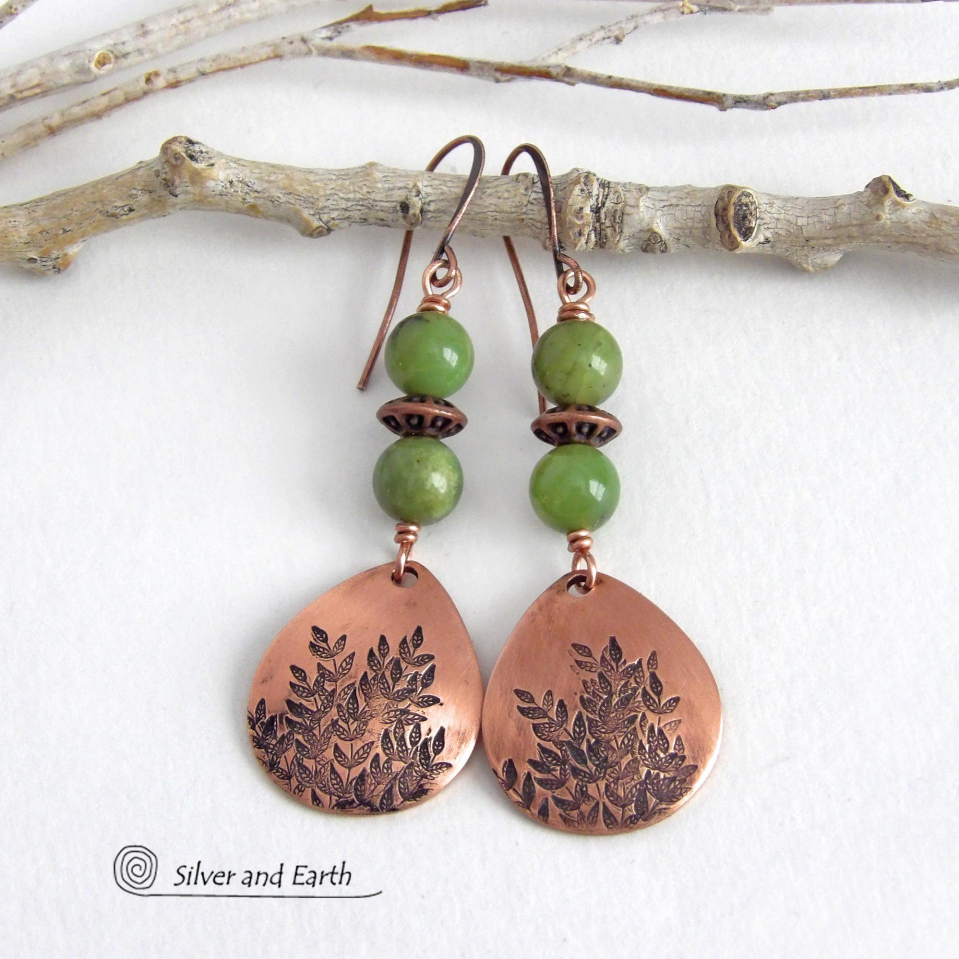These handcrafted earrings feature teardrop shaped copper dangles with a hand-stamped leaf texture accented with natural green jade gemstones and copper beads. They have an earthy, modern style that coordinates well with all wardrobe styles. They'll make a great gift for a nature lover - or a nice addition to your own jewelry wardrobe. Your choice of copper ear wires or niobium hypoallergenic ear wires. Earrings are handmade in the USA by Silver and Earth Jewelry. 