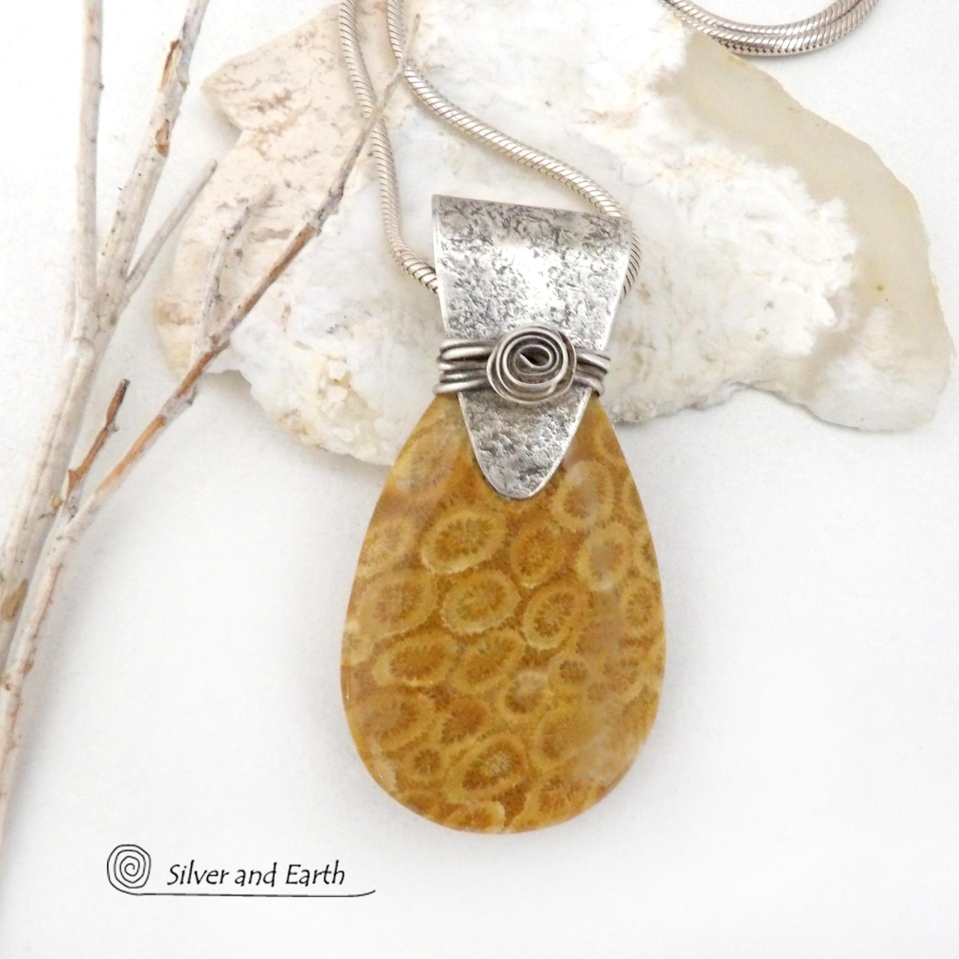 This unique *one-of-a-kind* necklace features a gorgeous fossil coral stone accented with a handcrafted sterling silver bail. Agatized fossil coral is a natural stone formed when ancient coral is gradually replaced with agate. The fossilized coral appear as small "flower-like" markings in the stone, resulting in terrific patterns. This necklace will make a great gift for anyone that loves natural stone jewelry -- or a nice addition to your own jewelry collection.
