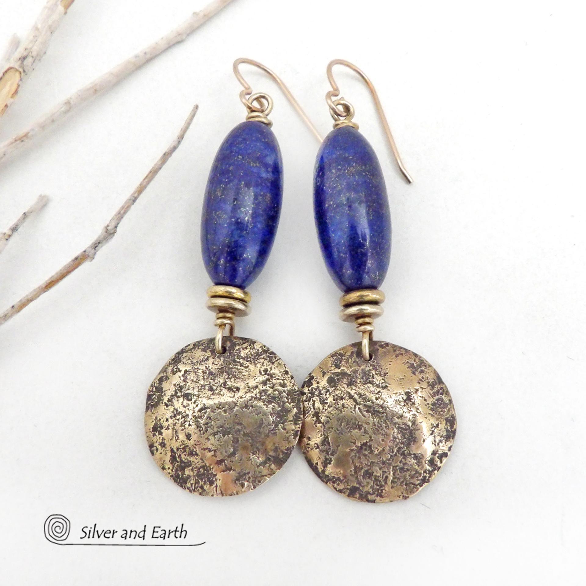 These handcrafted earrings feature beautiful long tube-shaped lapis lazuli gemstones accented with hammered gold brass dangles and tiny brass beads. The stones are a beautiful rich shade of blue with a sprinkling of natural sparkly pyrite inclusions. They have a modern, earthy chic elegance and can be worn with a variety of outfits - dressed up or down. Silver and Earth is a small business that makes beautiful handmade jewelry with high-quality natural materials. 