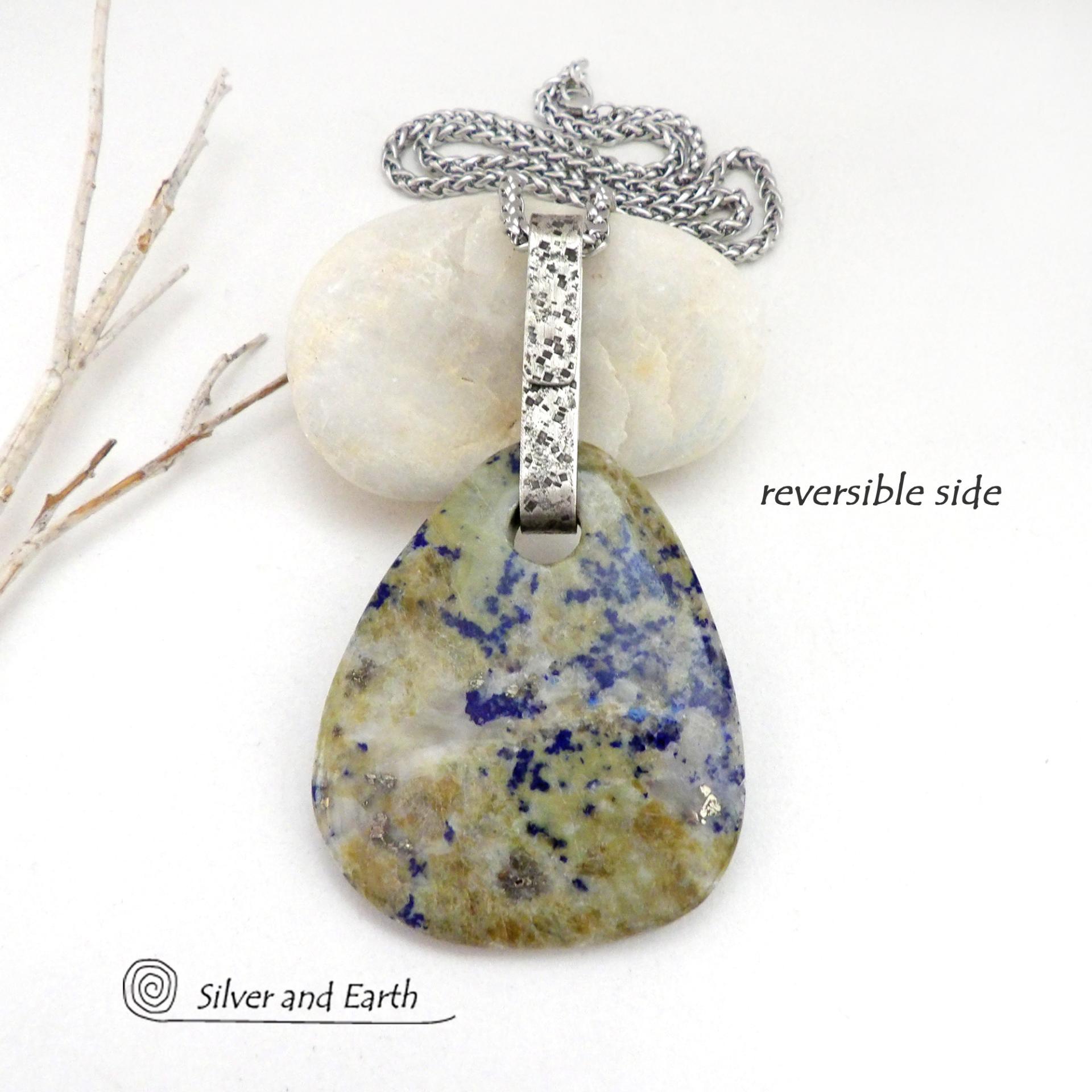 This one-of-a-kind necklace features a stunning natural gemstone comprised of natural lapis lazuli inclusions embedded in a calcite base. Lapis lazuli is formed with three minerals in varying amounts: lazurite, calcite, and pyrite. This stone has a unique matrix pattern with a blend of lapis with calcite which has a soft yellowish hue and a sprinkling of shimmery pyrite inclusions. Each side has it's own unique beauty, so I designed it to be reversible.