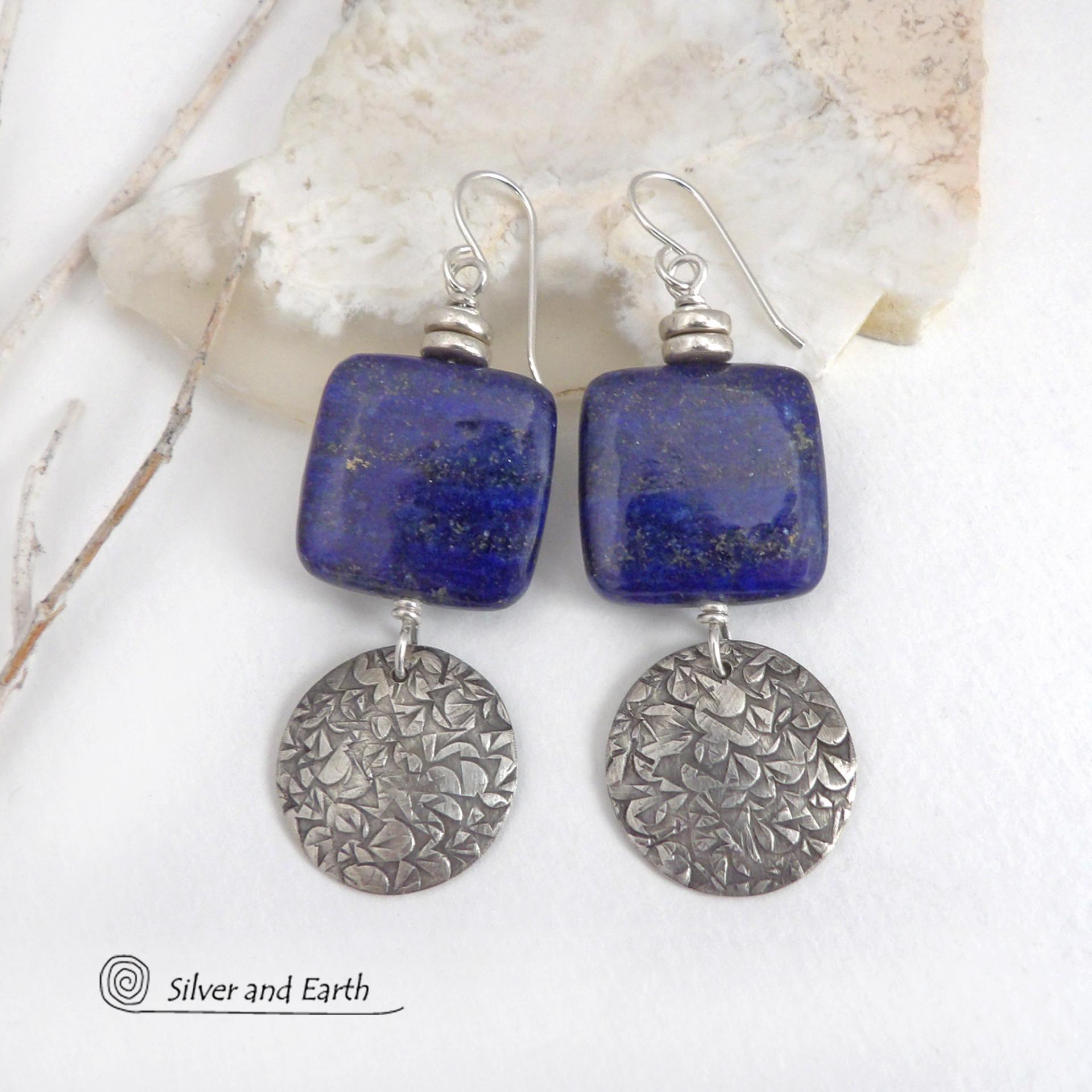 These earrings feature natural lapis lazuli gemstones accented with textured sterling silver dangles. The stones have a beautiful deep blue hue with natural pyrite inclusions. They are topped off with tiny pewter beads. The design is modern, classic, elegant and always in style. They'll coordinate beautifully with all wardrobe types. Handmade in the USA by Silver and Earth Jewelry. 