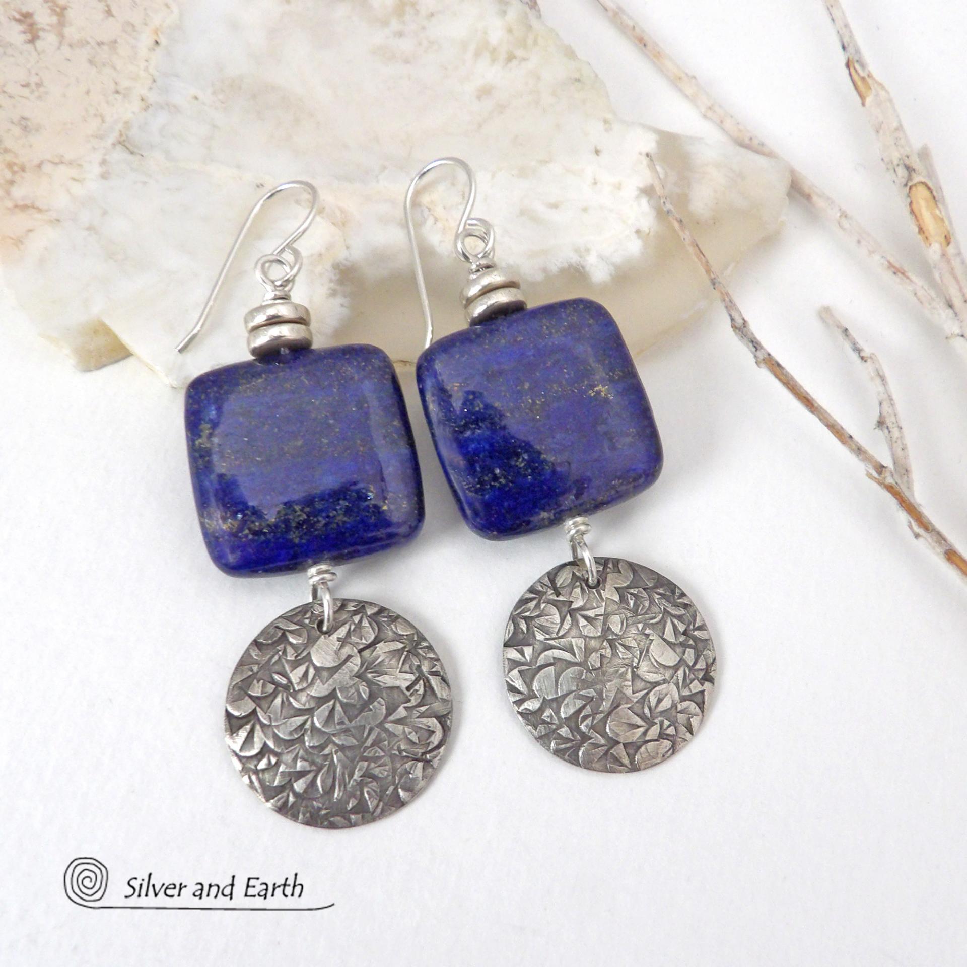These earrings feature natural lapis lazuli gemstones accented with textured sterling silver dangles. The stones have a beautiful deep blue hue with natural pyrite inclusions. They are topped off with tiny pewter beads. The design is modern, classic, elegant and always in style. They'll coordinate beautifully with all wardrobe types. Handmade in the USA by Silver and Earth Jewelry. 