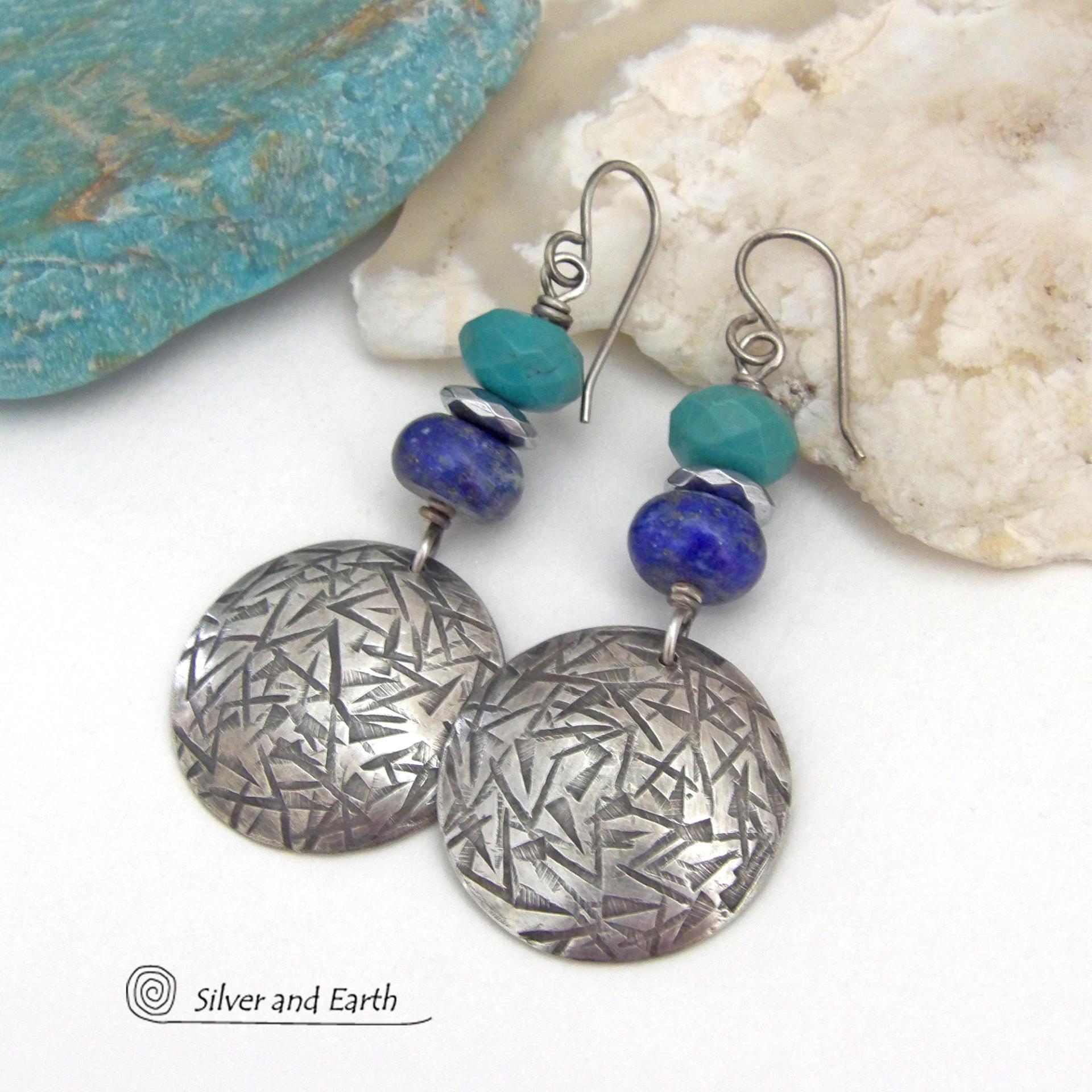 These handcrafted earrings feature sterling silver dangles with a hand stamped texture accented with faceted turquoise and lapis lazuli gemstones. Small hematite gemstones with a faceted finish were added for a touch of natural sparkle and shine. The earrings have a contemporary, modern chic style with a bit of southwestern flair. They'll coordinate beautifully with all wardrobe types - dressed up or down. Handmade in the USA by Silver and Earth Jewelry. 