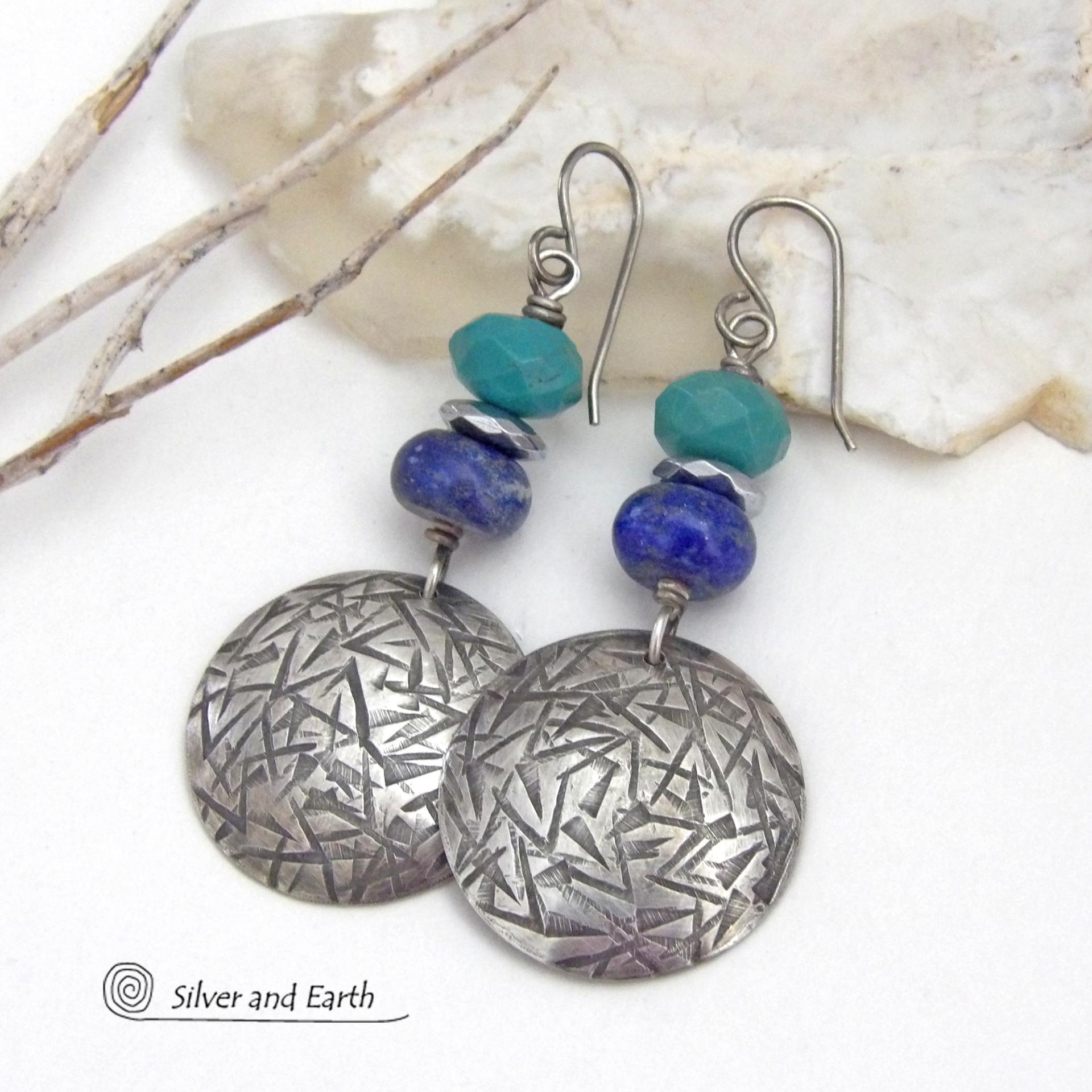 These handcrafted earrings feature sterling silver dangles with a hand stamped texture accented with faceted turquoise and lapis lazuli gemstones. Small hematite gemstones with a faceted finish were added for a touch of natural sparkle and shine. The earrings have a contemporary, modern chic style with a bit of southwestern flair. They'll coordinate beautifully with all wardrobe types - dressed up or down. Handmade in the USA by Silver and Earth Jewelry. 