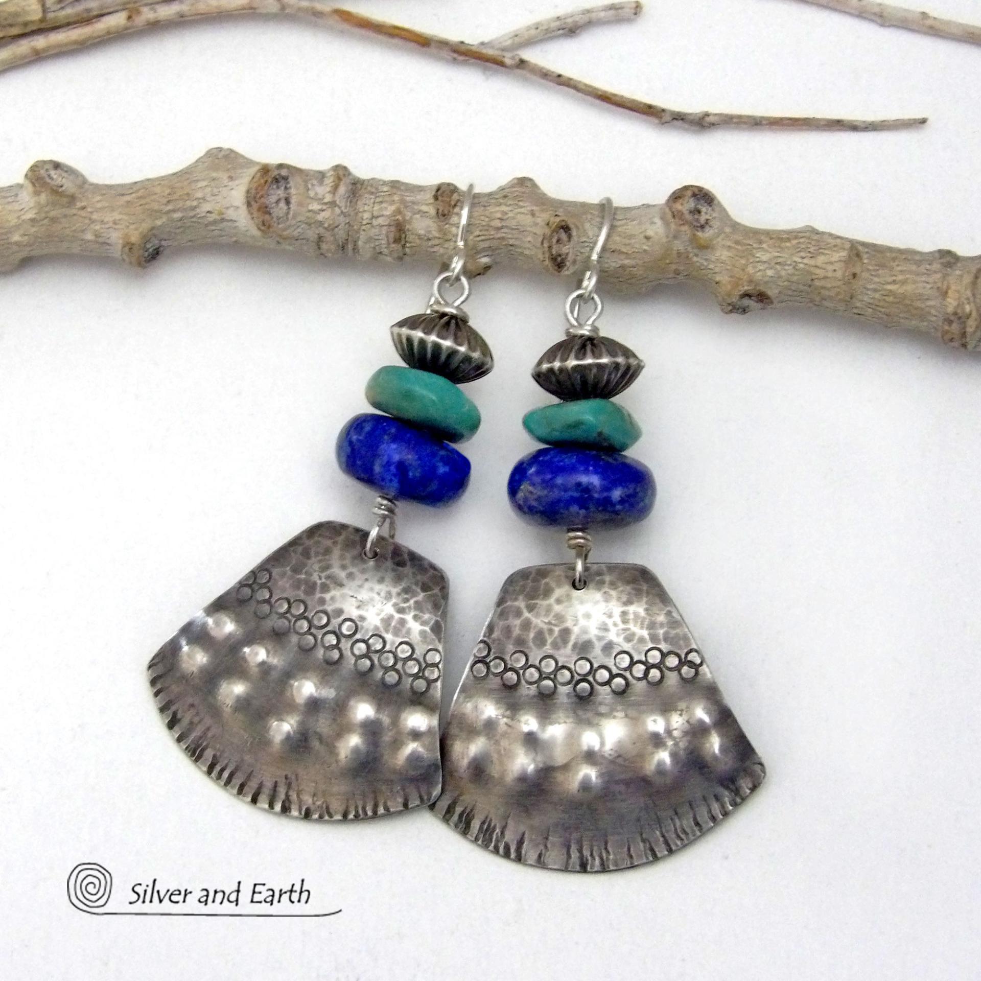 Bold and striking, these handcrafted earrings feature uniquely textured sterling silver accented with natural turquoise and lapis gemstones. They are topped off with Native style oxidized sterling silver beads with a rich, corrugated texture. They have a modern southwestern flair and are perfect for women that love to wear one-of-a-kind artisan handcrafted jewelry. Handmade in the USA by Silver and Earth - a New Mexico True Certified business.
