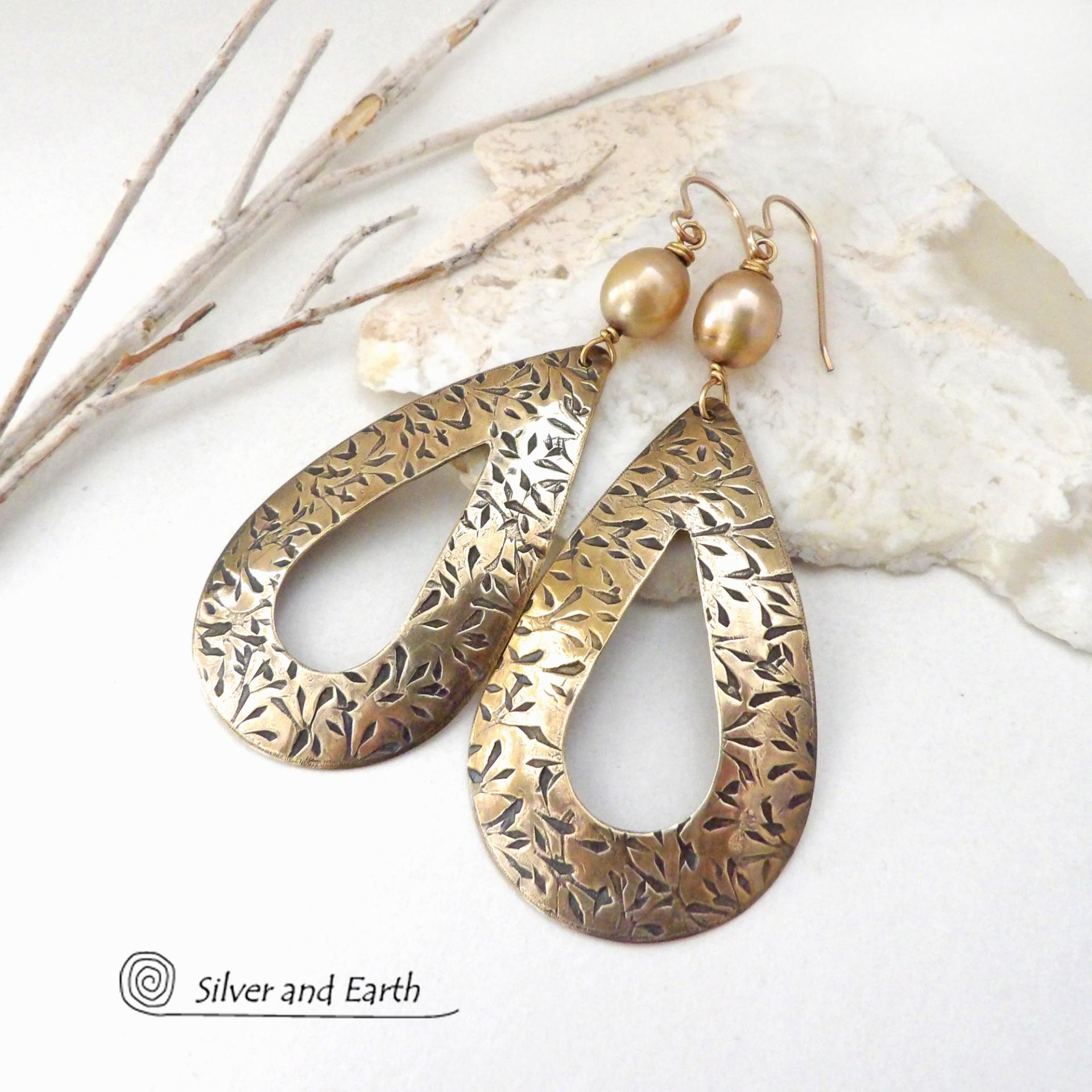 These gold brass hoop earrings have an intricate hand stamped texture and are accented with gold freshwater pearls. Big and bold, these earrings are a real statement piece and would be perfect for any occasion. 