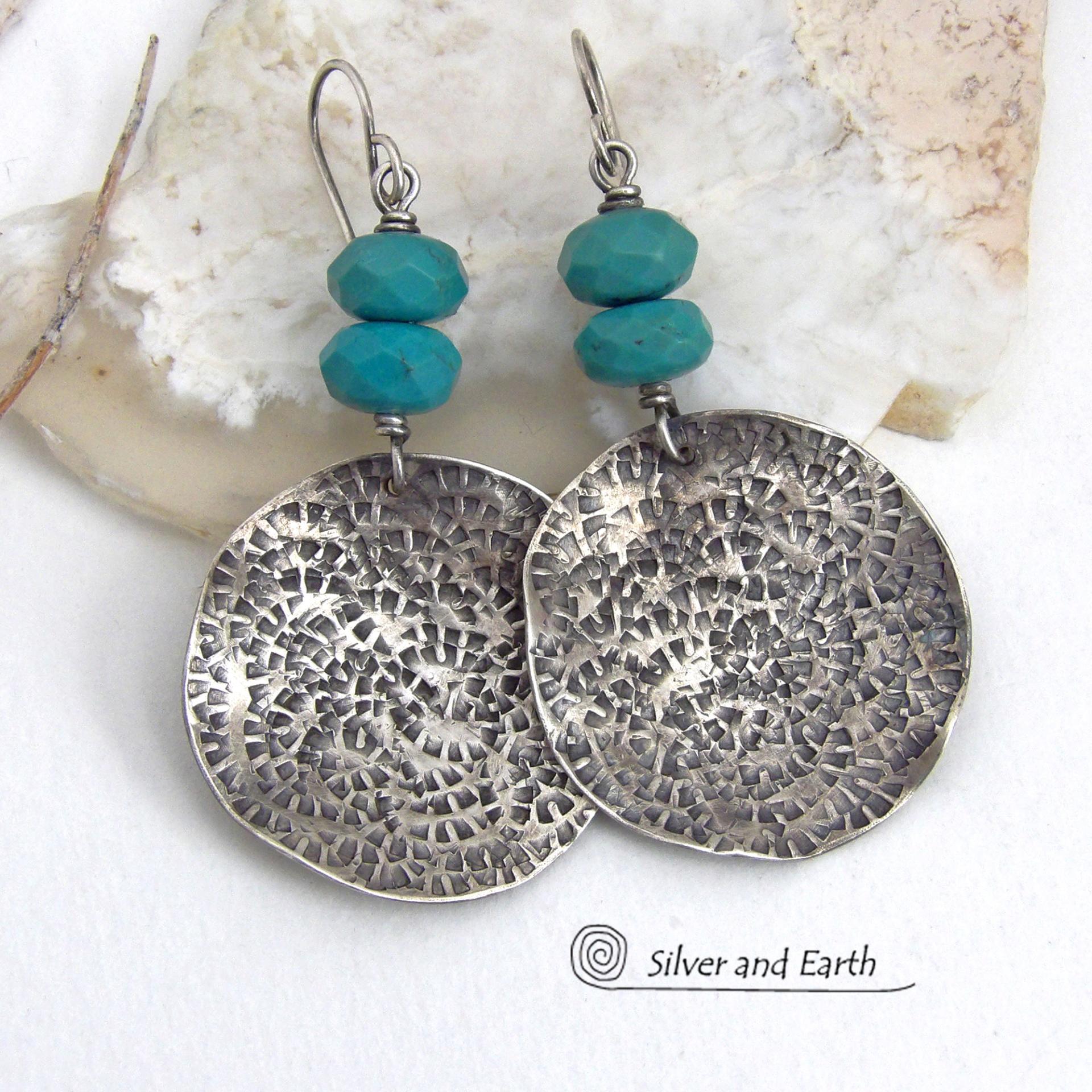 These handcrafted earrings feature large sterling silver round dangles with a hand stamped texture accented with natural turquoise gemstones with a faceted finish. Big and bold, they have a modern style with southwestern flair that looks great with all wardrobe types. Perfect for women that love large earrings and bold statement jewelry. Handmade in the USA by Silver and Earth Jewelry, a New Mexico True Certified business.