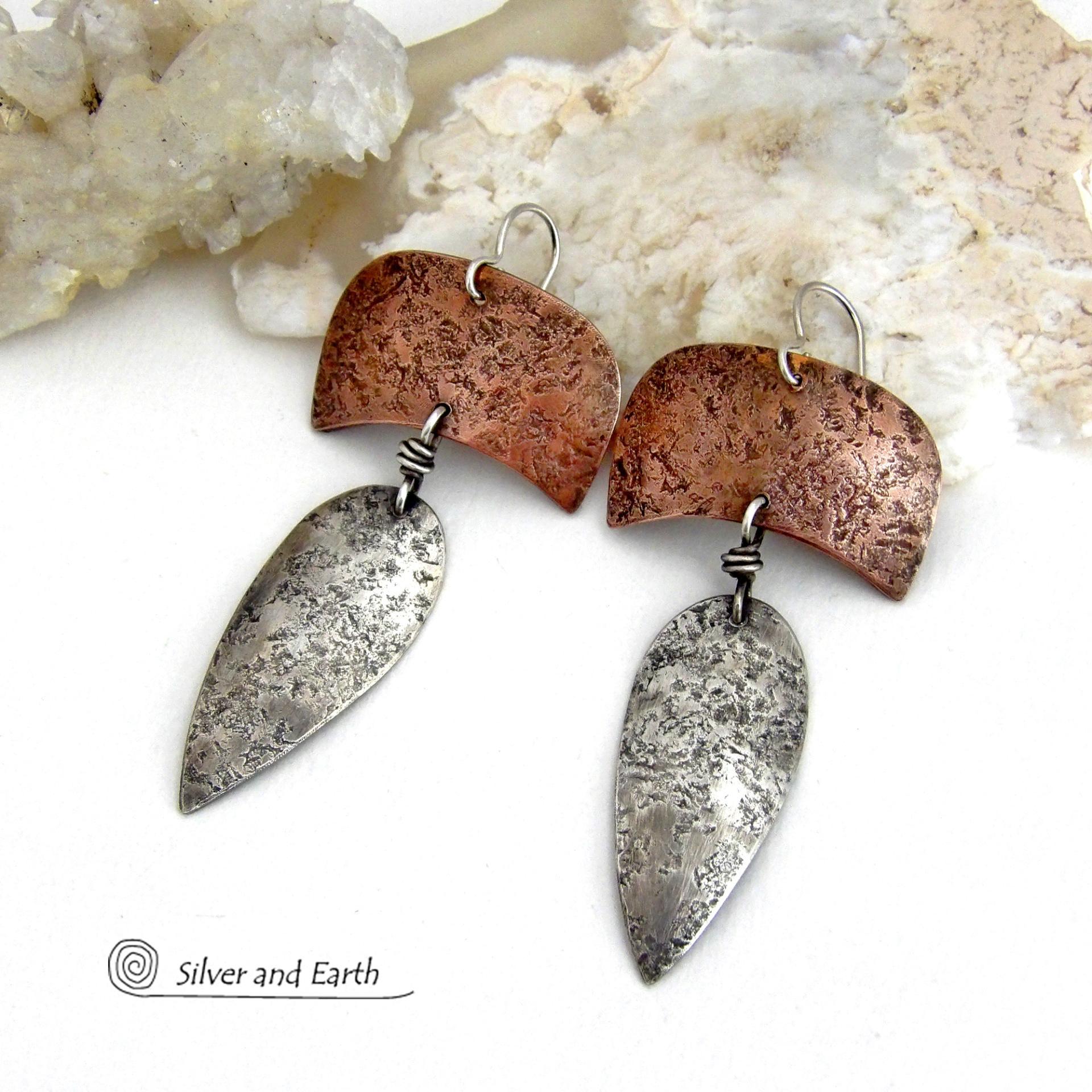 These handcrafted sterling silver and copper mixed metal earrings have an earthy, organic style with a modern tribal vibe. Unique and versatile, the combination of metals enables them to mix and match with other copper and silver accessories in your wardrobe. Handmade in the USA by Silver and Earth Jewelry.