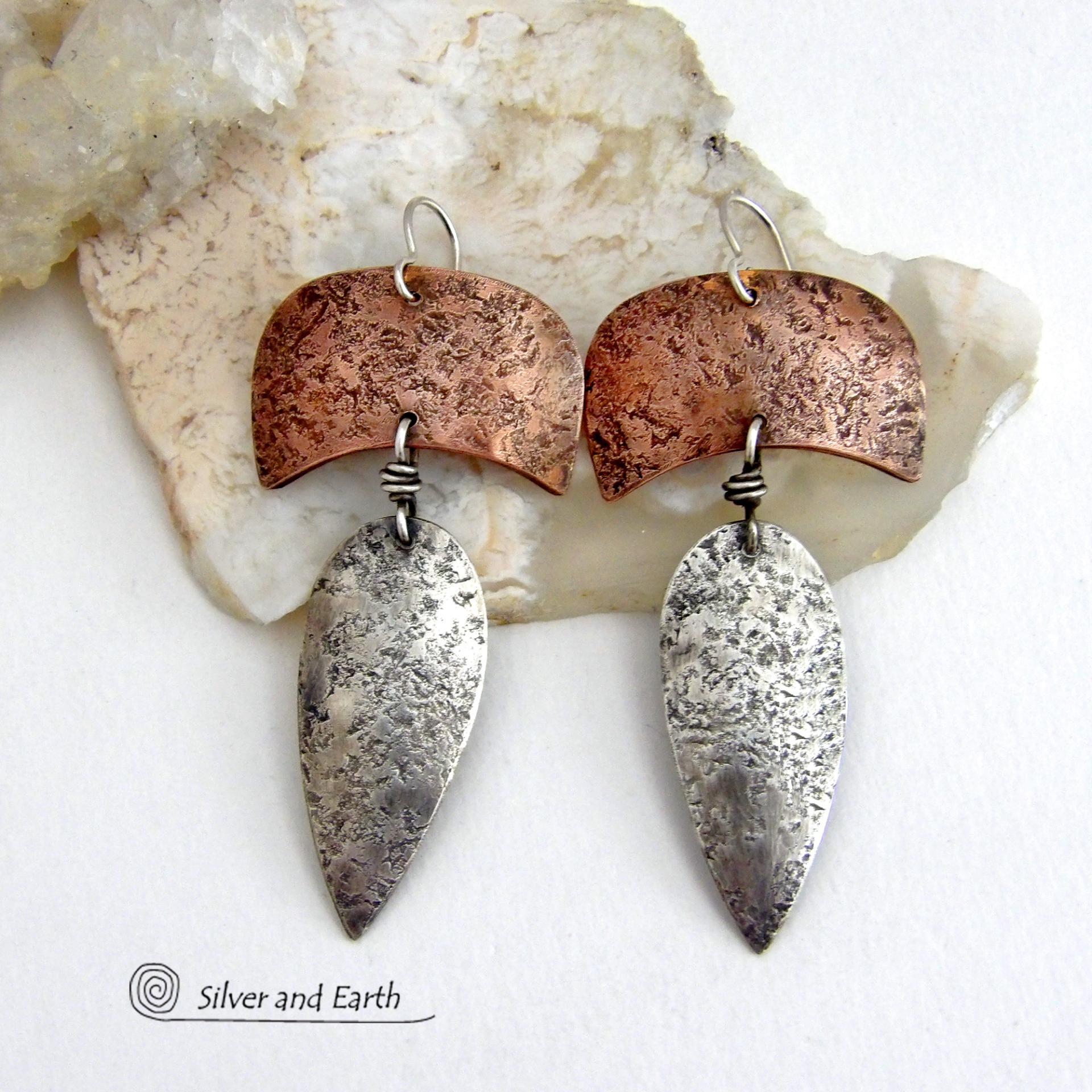 These handcrafted sterling silver and copper mixed metal earrings have an earthy, organic style with a modern tribal vibe. Unique and versatile, the combination of metals enables them to mix and match with other copper and silver accessories in your wardrobe. Handmade in the USA by Silver and Earth Jewelry.