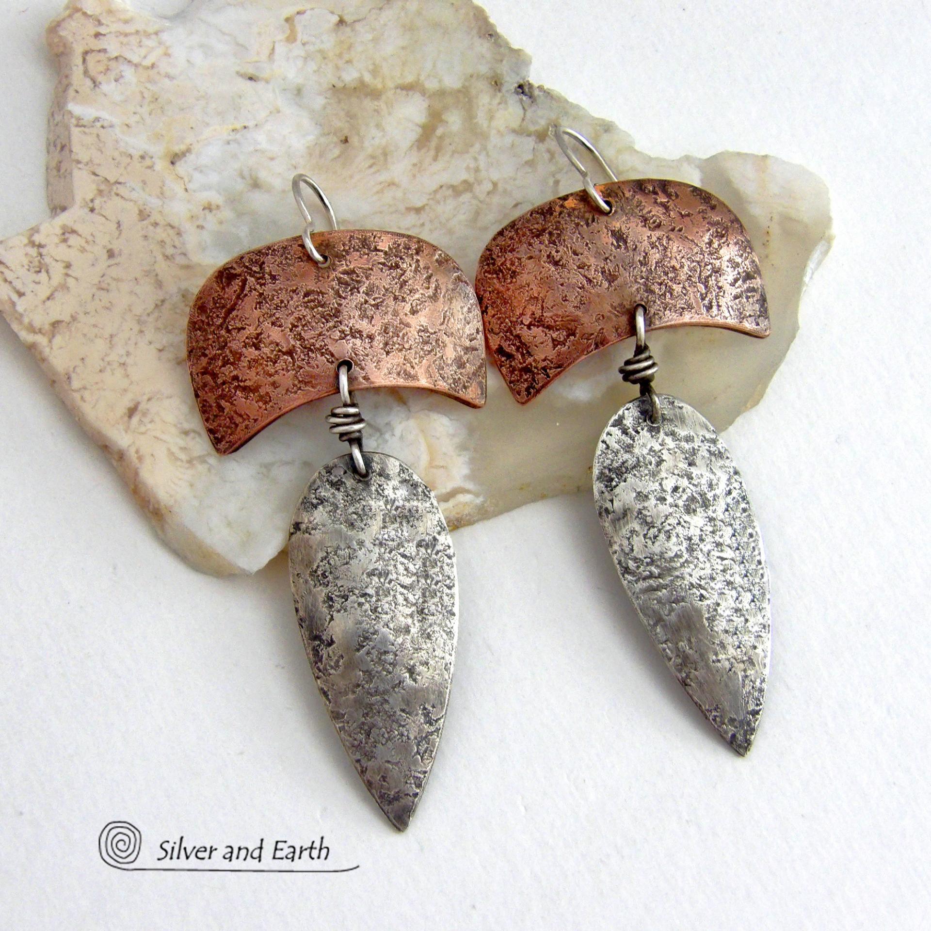 These handcrafted sterling silver and copper mixed metal earrings have an earthy, organic style with a modern tribal vibe. Unique and versatile, the combination of metals enables them to mix and match with other copper and silver accessories in your wardrobe. Handmade in the USA by Silver and Earth Jewelry.