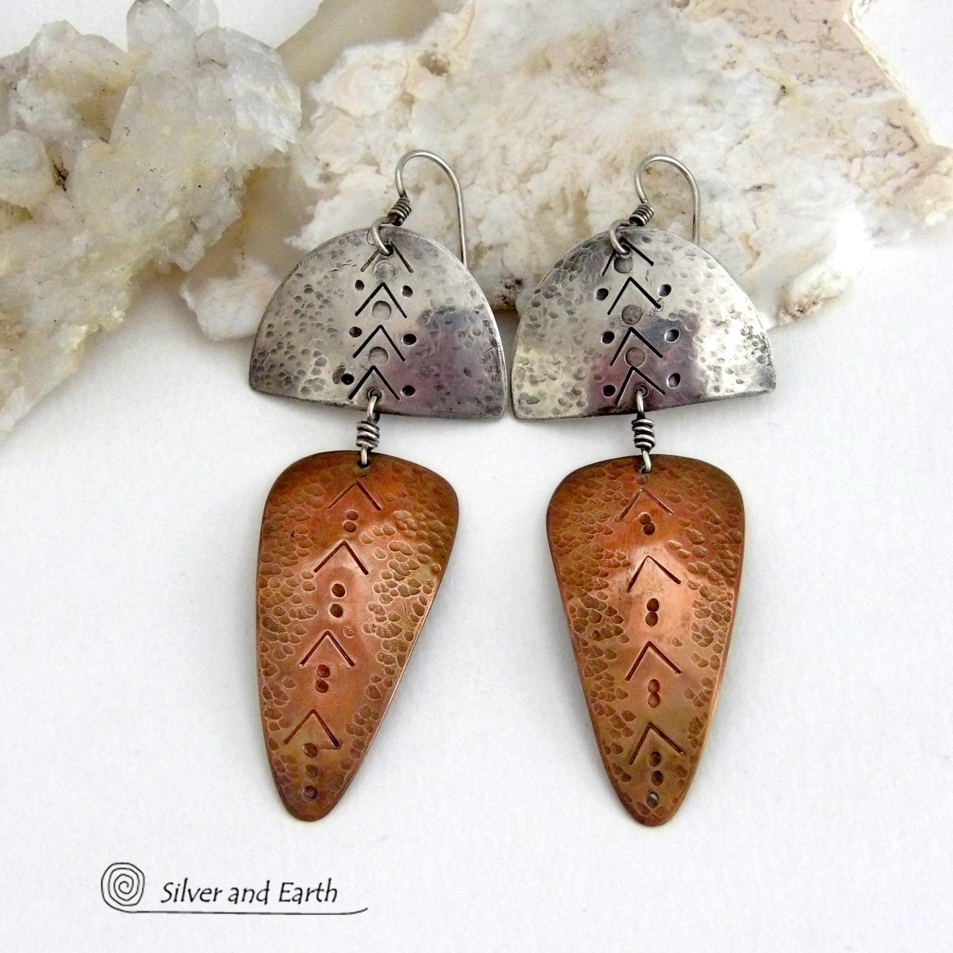 Unique and striking, these handcrafted mixed metal sterling silver and copper earrings will make a bold statement. They have a modern contemporary style with a tribal vibe. The combination of metals will mix and match beautifully with other copper and silver accessories in your wardrobe. Handmade in the USA by Silver and Earth Jewelry.