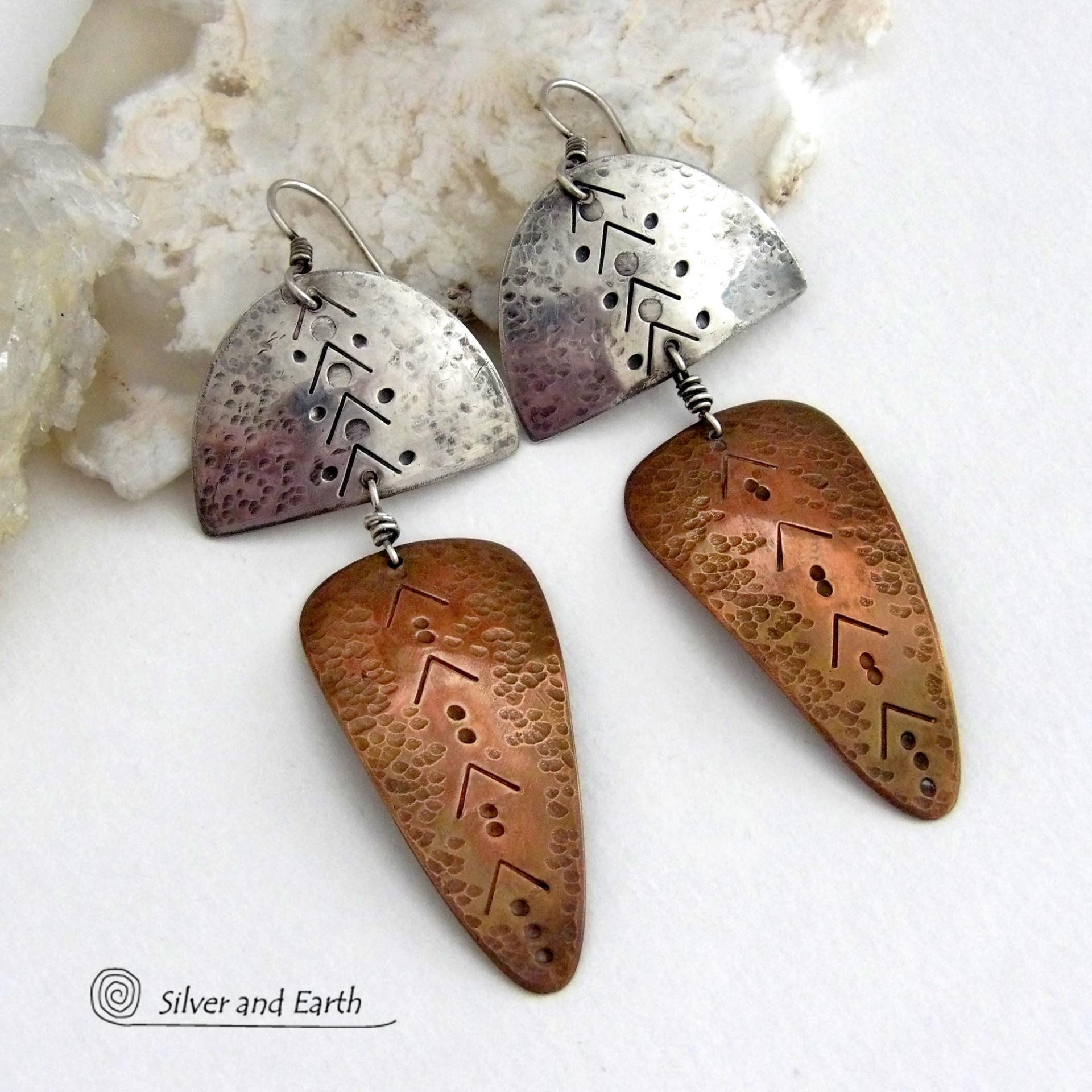 Unique and striking, these handcrafted mixed metal sterling silver and copper earrings will make a bold statement. They have a modern contemporary style with a tribal vibe. The combination of metals will mix and match beautifully with other copper and silver accessories in your wardrobe. Handmade in the USA by Silver and Earth Jewelry.