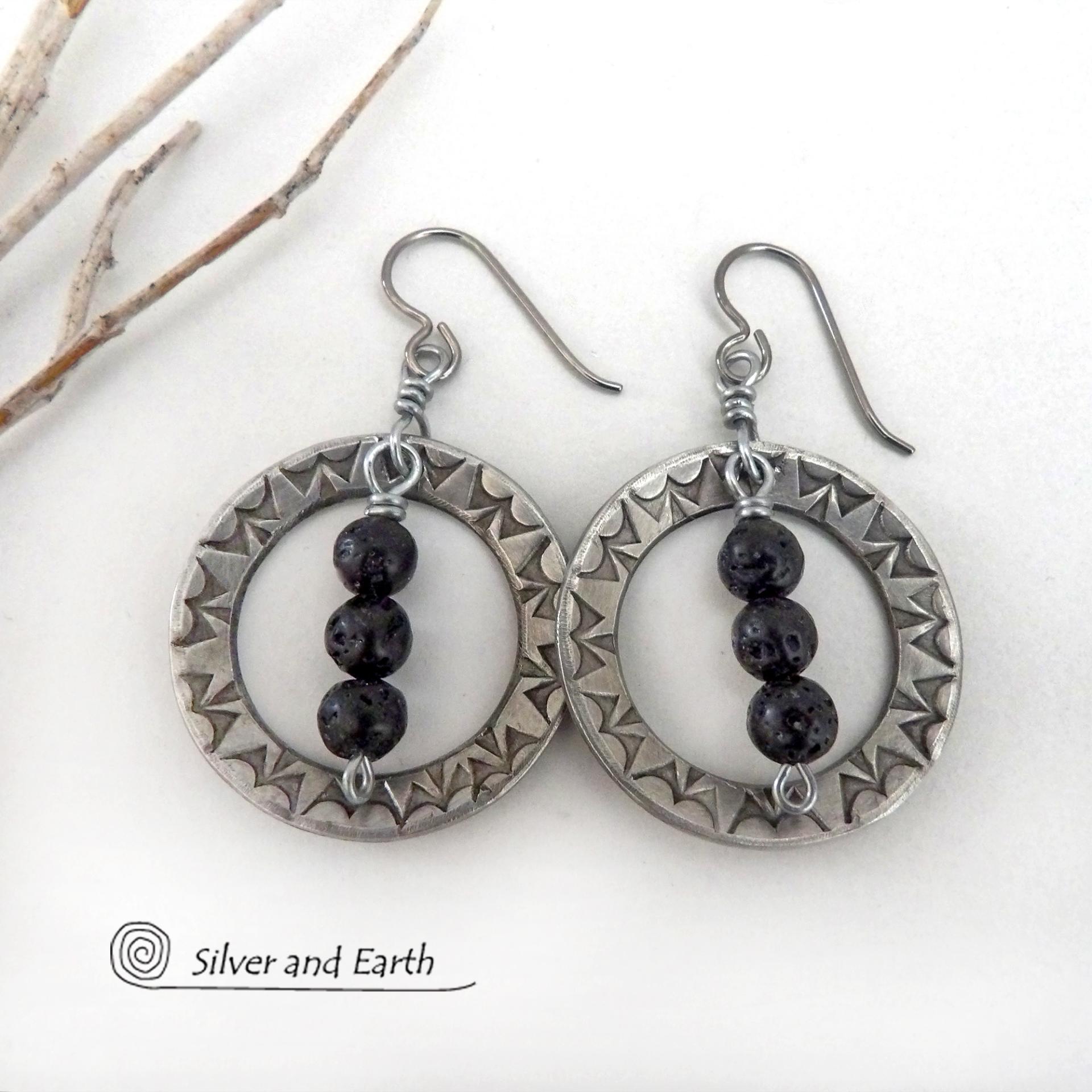 These handcrafted silver pewter hoop earrings have a hand stamped texture accented with black lava rock stones dangling in front. The stones have natural "pits" and crevices which is expected with porous lava stones. Lava stone is formed when molten rock erupts from an active volcano and comes in contact with the cool atmosphere of the Earth, which begins to solidify it. They have an earthy chic style that coordinates with all wardrobe types.