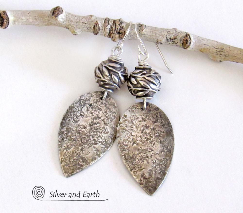 https://www.silverandearth.com/sites/silverandearth.indiemade.com/files/styles/product_image/public/products/pewter%20leaf%20bead%20sterling%20silver%20earrings%203.jpg?itok=cC6nrrUw