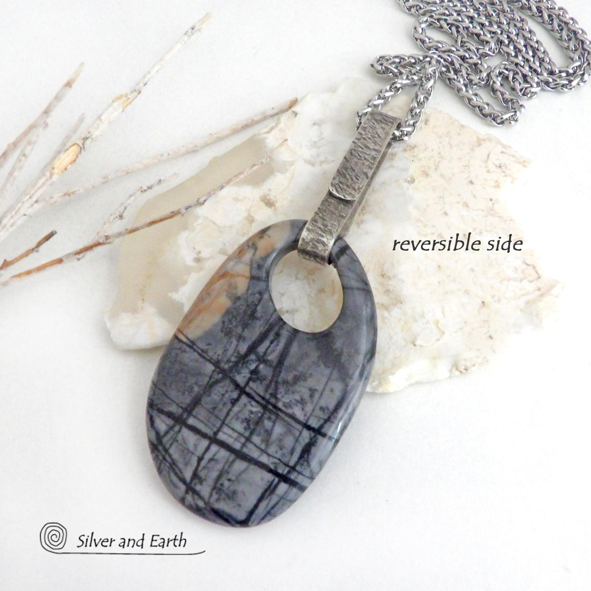 This one-of-a-kind necklace features a gorgeous natural Picasso marble gemstone accented with a hand forged sterling silver bail with a lightly hammered organic texture. The stone has earth tone shades of black, grey and some brown with an interesting matrix of abstract lines. This semiprecious stone is found only in southwest Utah. Makes a great gift for a natural stone lover - or a nice addition to your own jewelry wardrobe.