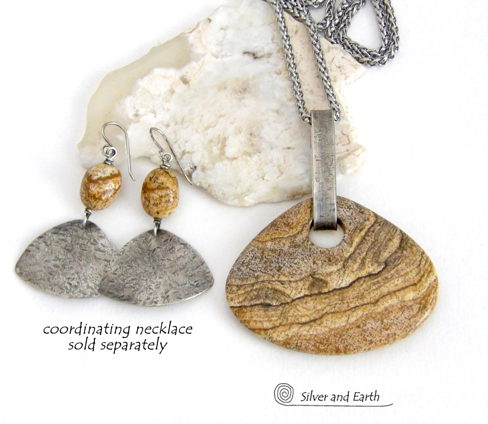 These handcrafted earrings feature natural picture jasper stones accented with textured sterling silver dangles. They have a modern, earthy design that looks great with all wardrobe styles. The stones have a natural pattern of brown streaks and black speckles against a tan background. I created the dangles out of solid sterling silver sheet; hammered them for an earth, organic texture; then oxidized them to enhance the detail. Earrings have a coordinating necklace sold separately. 
