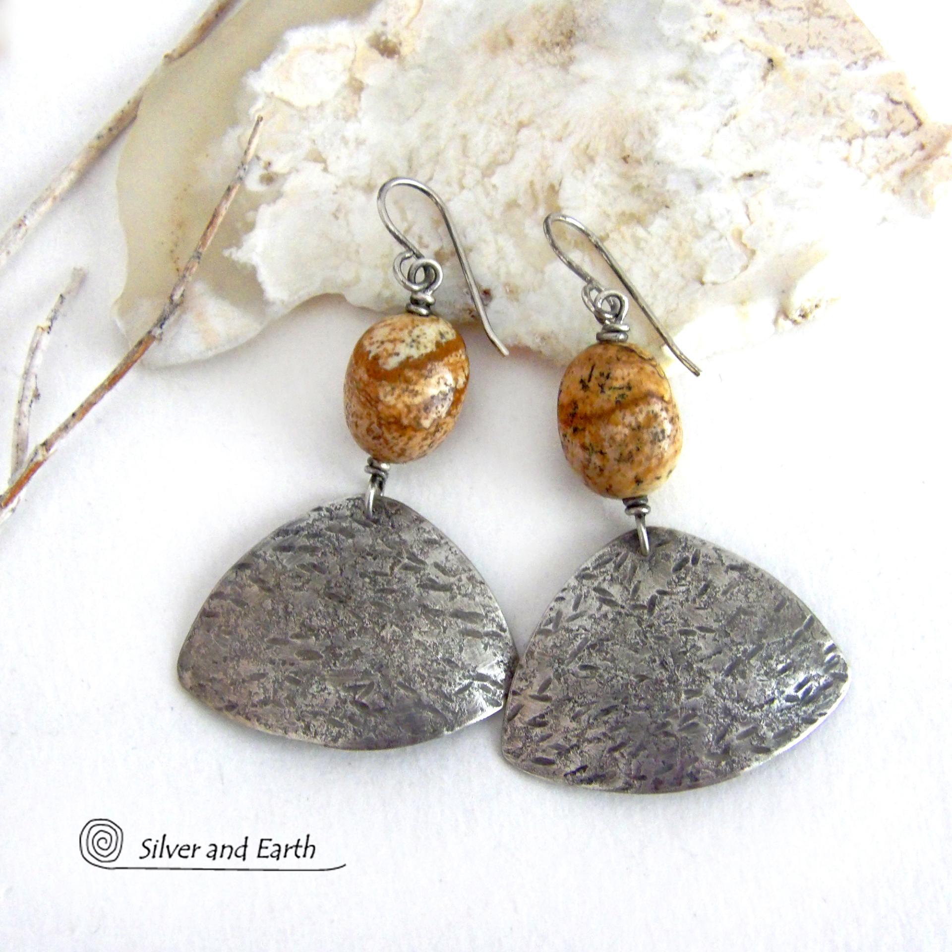 These handcrafted earrings feature natural picture jasper stones accented with textured sterling silver dangles. They have a modern, earthy design that looks great with all wardrobe styles. The stones have a natural pattern of brown streaks and black speckles against a tan background. I created the dangles out of solid sterling silver sheet; hammered them for an earth, organic texture; then oxidized them to enhance the detail. Earrings have a coordinating necklace sold separately. 