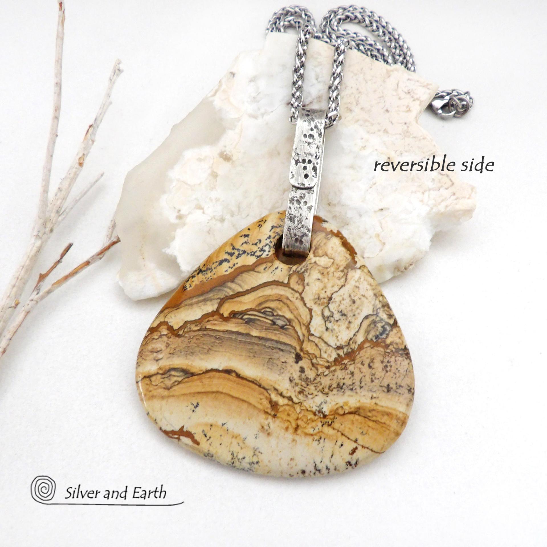 This one-of-a-kind necklace features a large stunning picture jasper stone accented with a handcrafted sterling silver bail. The stone has a beautiful natural pattern in various shades of brown, beige and gray. Big and bold, this necklace is a real statement piece - perfect for anyone that loves natural stones! 