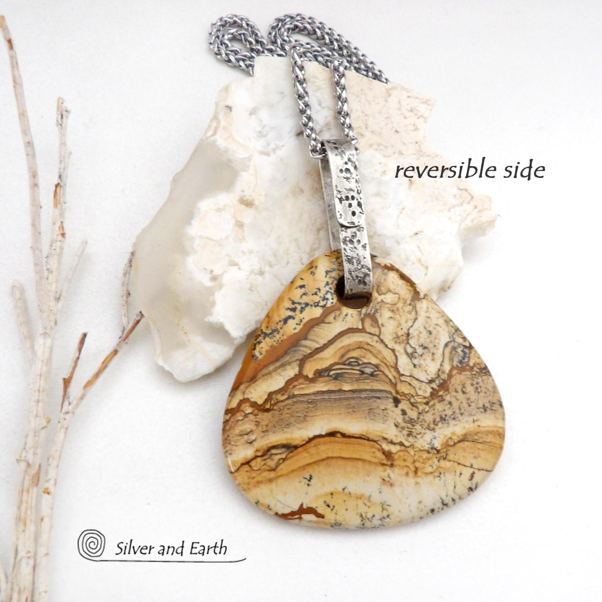 This one-of-a-kind necklace features a large stunning picture jasper stone accented with a handcrafted sterling silver bail. The stone has a beautiful natural pattern in various shades of brown, beige and gray. Big and bold, this necklace is a real statement piece - perfect for anyone that loves natural stones! 