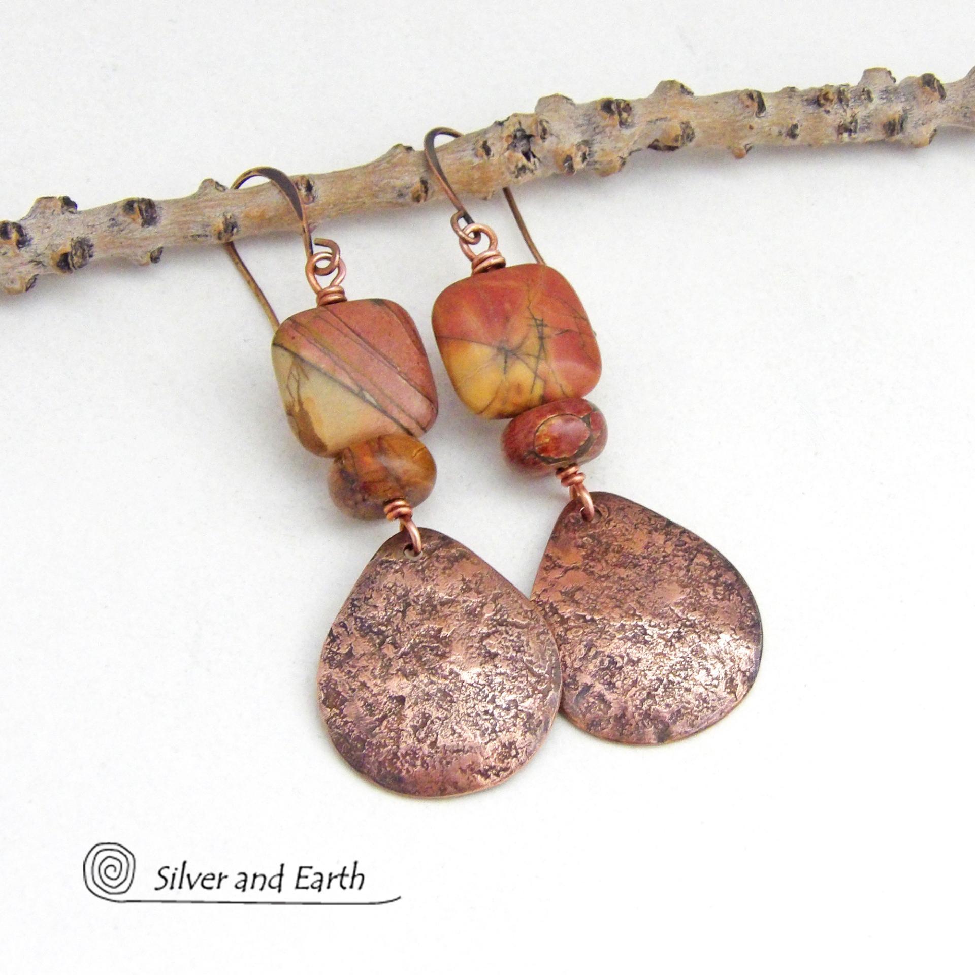 These earrings feature natural red creek jasper gemstones accented with handcrafted copper teardrop dangles. The stones have earthy hues of soft brick red, orange, golden yellow and streaks of brown and green. They'll make a great gift for a natural stone lover - or couples celebrating their 7th wedding anniversary - copper is the traditional choice for this occasion.