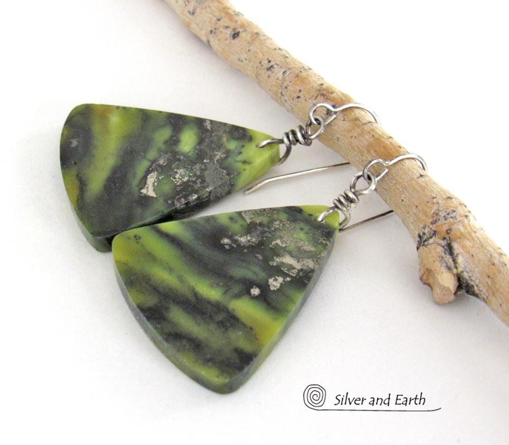 These one-of-a-kind earrings feature gorgeous slices of natural serpentine gemstones in hues of green and black, along with a sprinkling of sparkly pyrite inclusions. They have an earthy, modern style that looks great with all wardrobe types. Makes a great gift for a natural stone lover - or a nice addition to your own jewelry collection.