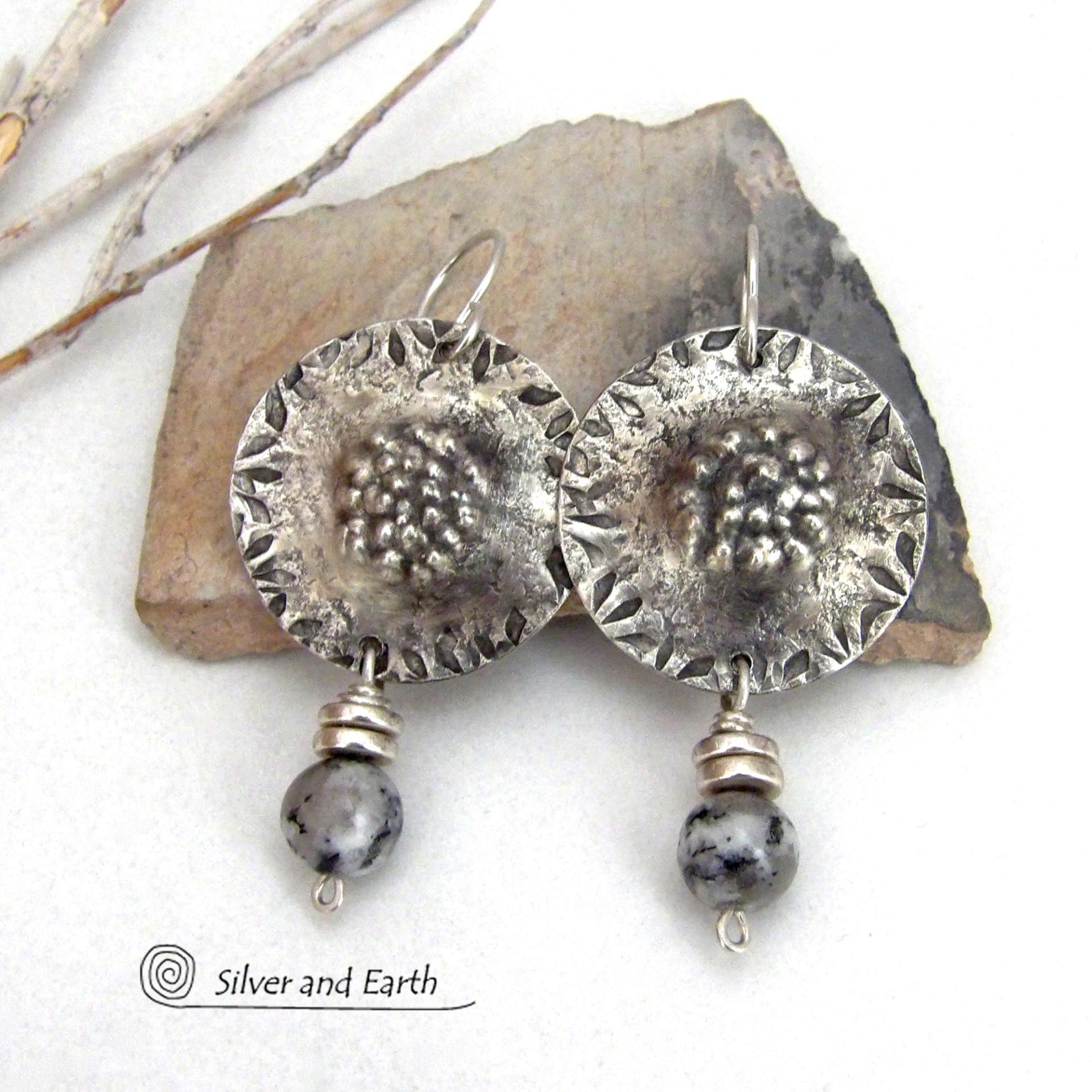 These handcrafted sterling silver earrings have a hammered and hand stamped texture and are accented with granite agate gemstones and silver pewter beads. The stones have a natural speckled matrix of black, white and gray that resembles granite. They have a bold chic, contemporary modern style that makes a unique statement.