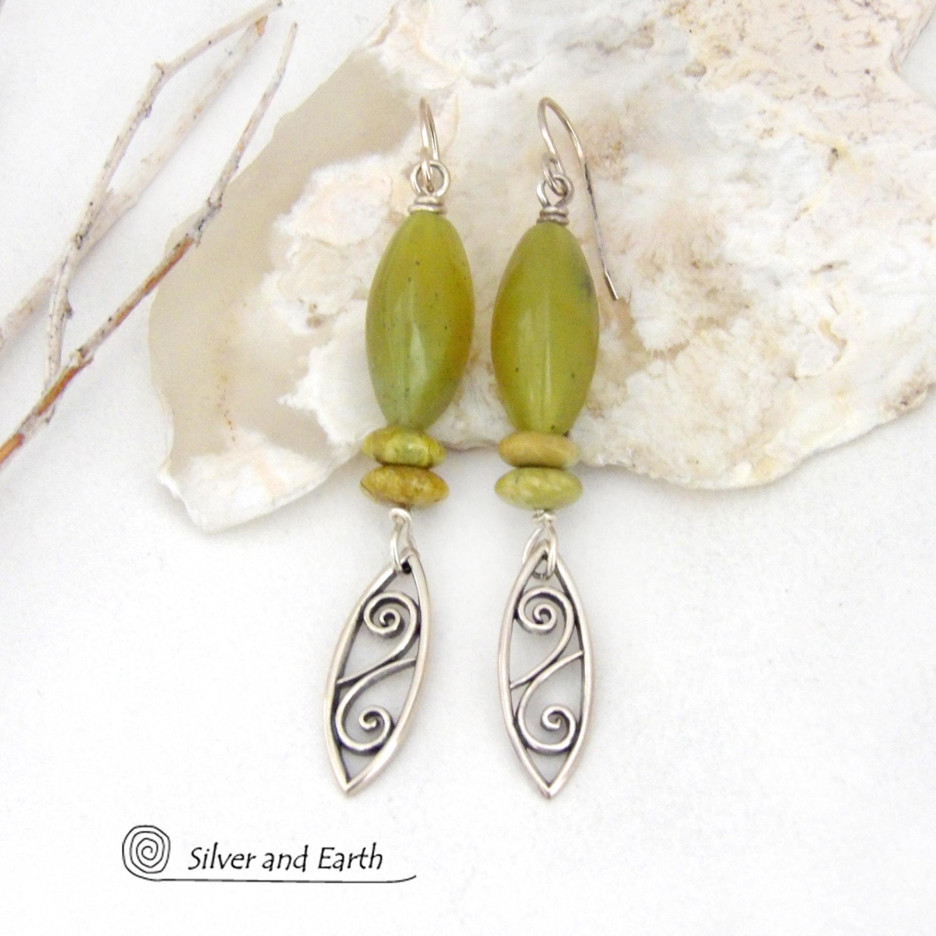 These sterling silver earrings have an earthy, classic and modern feel. They feature sterling silver leaf shapes with a scrolling spiral pattern accented with natural green serpentine gemstones. Lightweight and comfortable to wear, they'll coordinate with all wardrobe styles. 