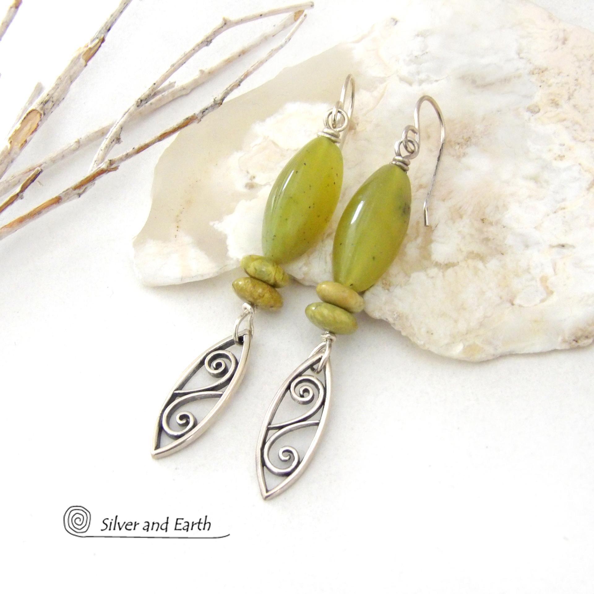These sterling silver earrings have an earthy, classic and modern feel. They feature sterling silver leaf shapes with a scrolling spiral pattern accented with natural green serpentine gemstones. Lightweight and comfortable to wear, they'll coordinate with all wardrobe styles. 