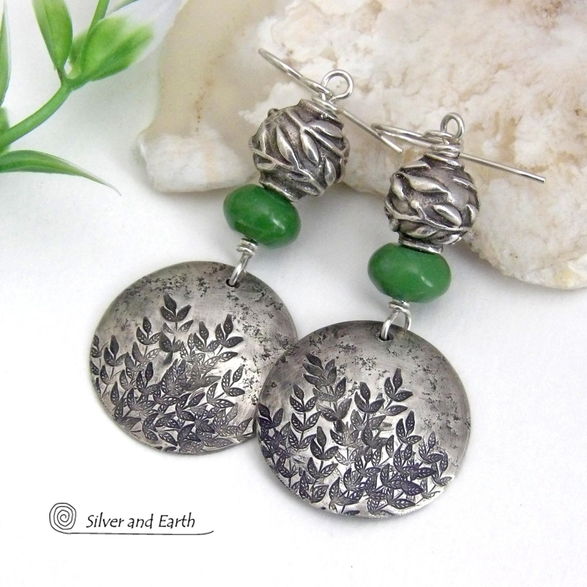 These handcrafted sterling silver earrings feature a hand stamped leaf design and are accented with green serpentine gemstones and pewter beads. The beads have a beautifully detailed 3-dimensional carved pattern of vines and leaves. They have a modern, earthy and elegant style that coordinates beautifully with all wardrobe types. They'll make a great gift for a nature lover - or a nice addition to your own jewelry wardrobe.