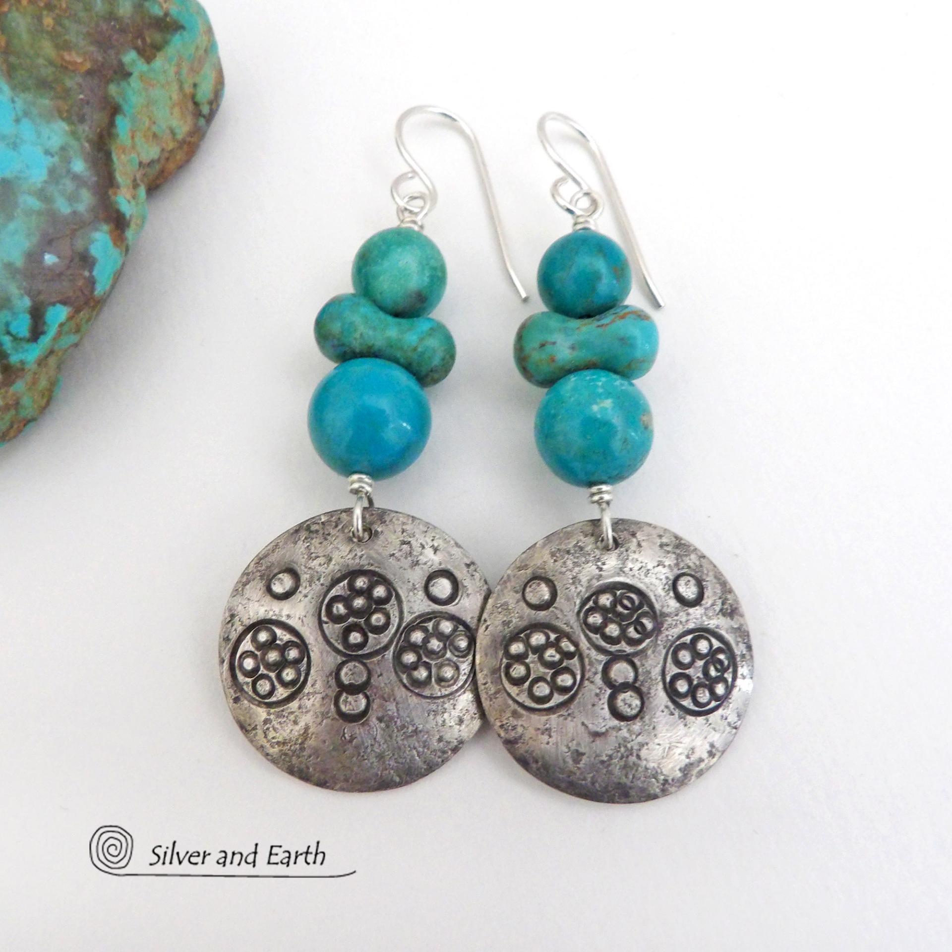 These handcrafted earrings feature sterling silver dangles with a hand stamped texture accented with a stack of round and uniquely "bow shaped" genuine natural turquoise stones. Bold and striking, they have an earthy modern rustic vibe with southwest style and flair that will look great with all types of outfits.  These earrings are perfect for women that love natural stones and unique, one-of-a-kind statement jewelry.