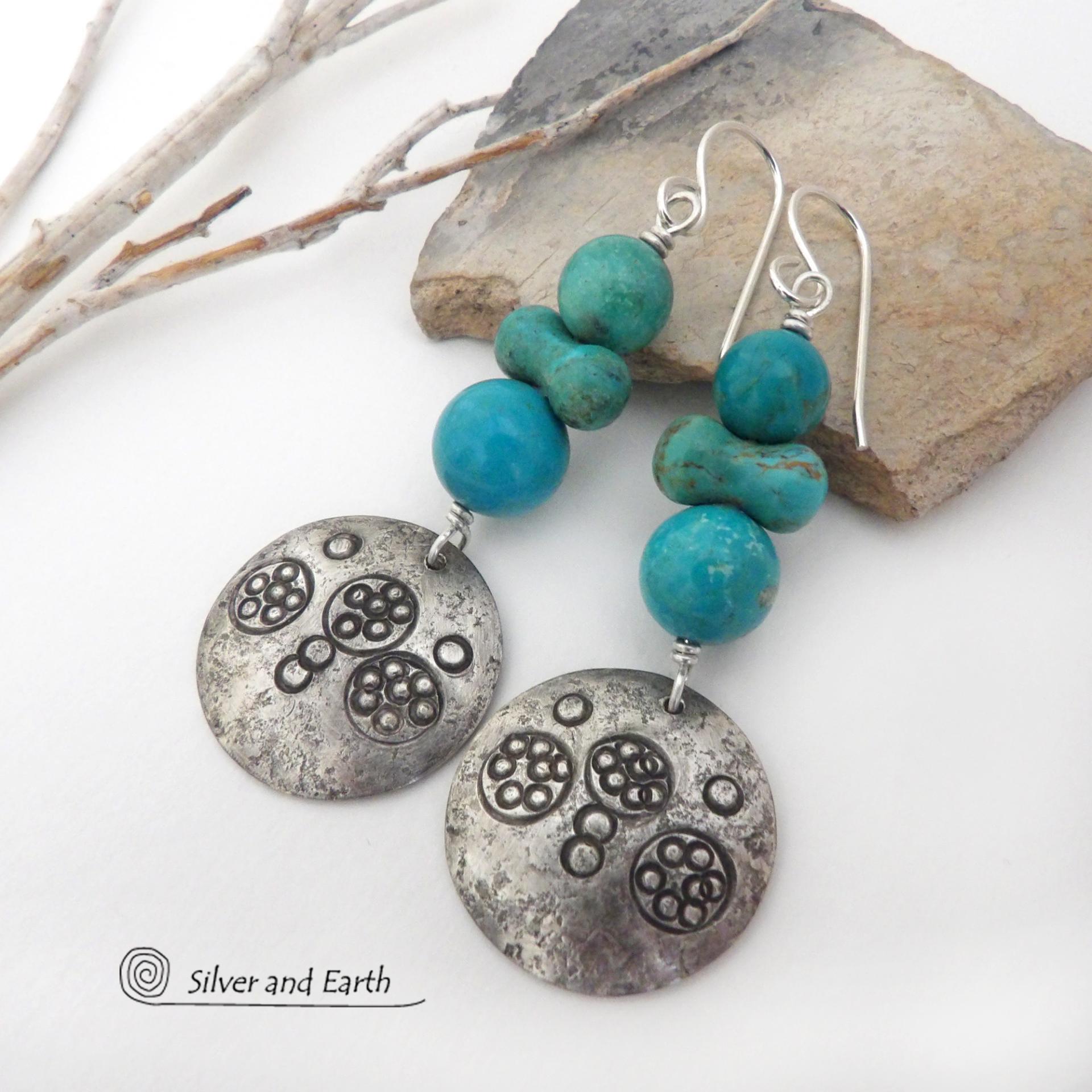 These handcrafted earrings feature sterling silver dangles with a hand stamped texture accented with a stack of round and uniquely "bow shaped" genuine natural turquoise stones. Bold and striking, they have an earthy modern rustic vibe with southwest style and flair that will look great with all types of outfits. Handmade in the USA, Silver and Earth is a small business that is New Mexico True Certified. She is known for her known for her unique one-of-a-kind and limited edition designs.