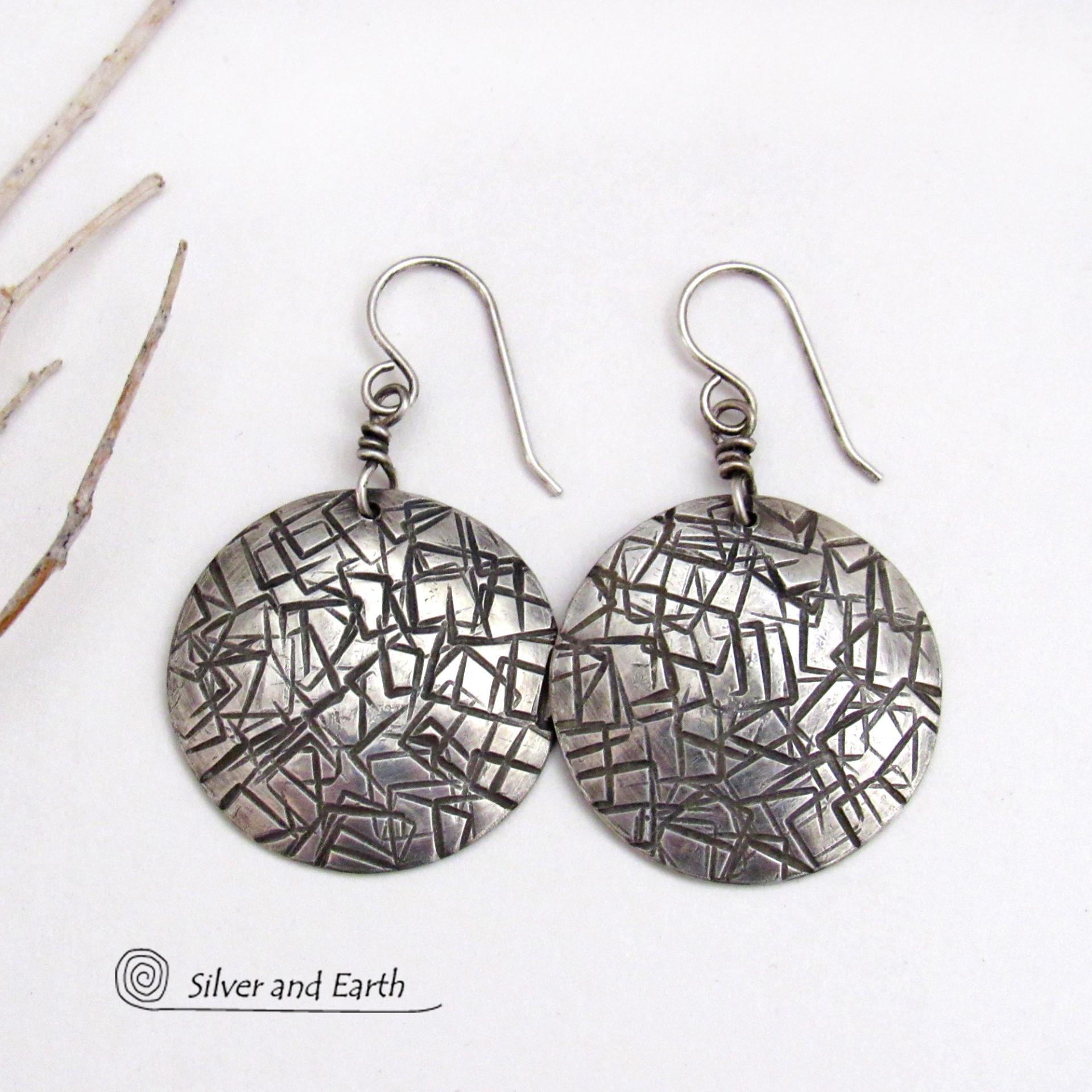 These handcrafted sterling silver earrings have a simplistic, modern style that is perfect for everyday wear because they go with everything. They have a hand stamped abstract texture that was oxidized to highlight the details. Lightweight and comfortable to wear, they'll coordinate beautifully with all wardrobe styles. 