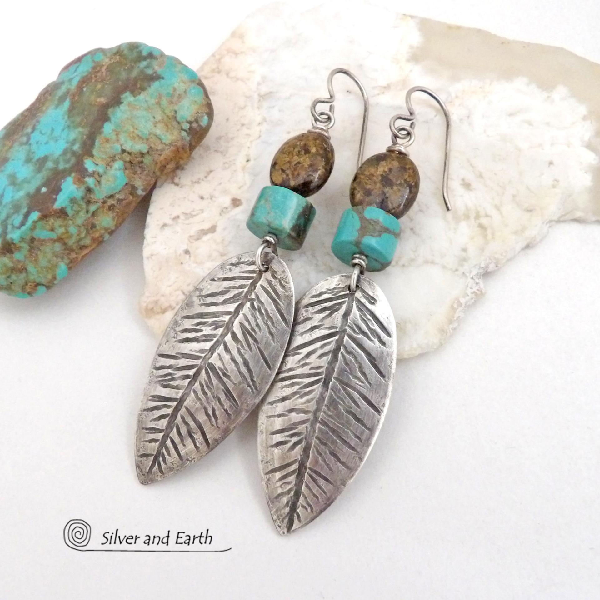 These handcrafted sterling silver feather earrings have a hand stamped texture and are accented with turquoise and bronzite stones which bring out the natural brown matrix in the turquoise stones. They have a native southwestern vibe that makes a bold statement. Perfect for anyone that loves the southwest style. Earrings measure 2-7/8" in length. Handmade exclusively by Silver and Earth. 