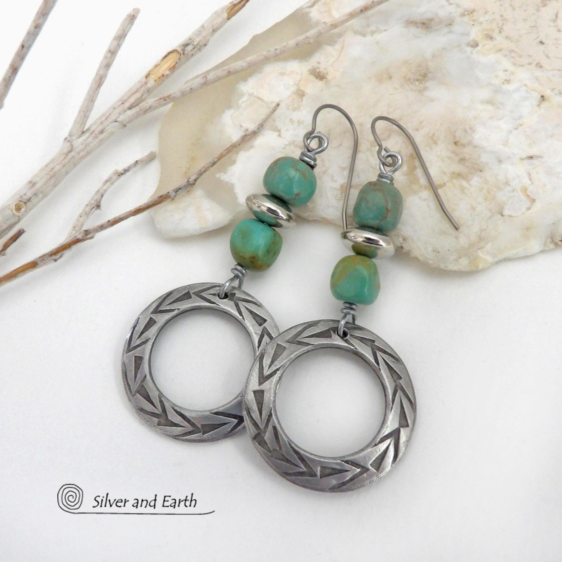 These handcrafted earrings feature silver pewter hoops with a hand stamped texture accented with natural, genuine turquoise stones and silver plated beads. Lightweight and comfortable to wear, they have an earthy modern style with southwest flair that coordinates beautifully with all wardrobe types. Handmade in the USA by Silver and Earth Jewelry, a Certified New Mexico True business.